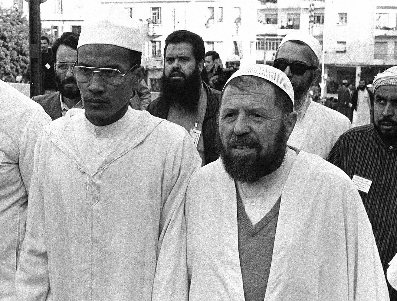 The historic leader of the Islamic Salvation Front (FIS), Abbasi Madani (R), stands next to Ali Belhadj, the movement's number two, in Algiers in May 1991 (AFP)