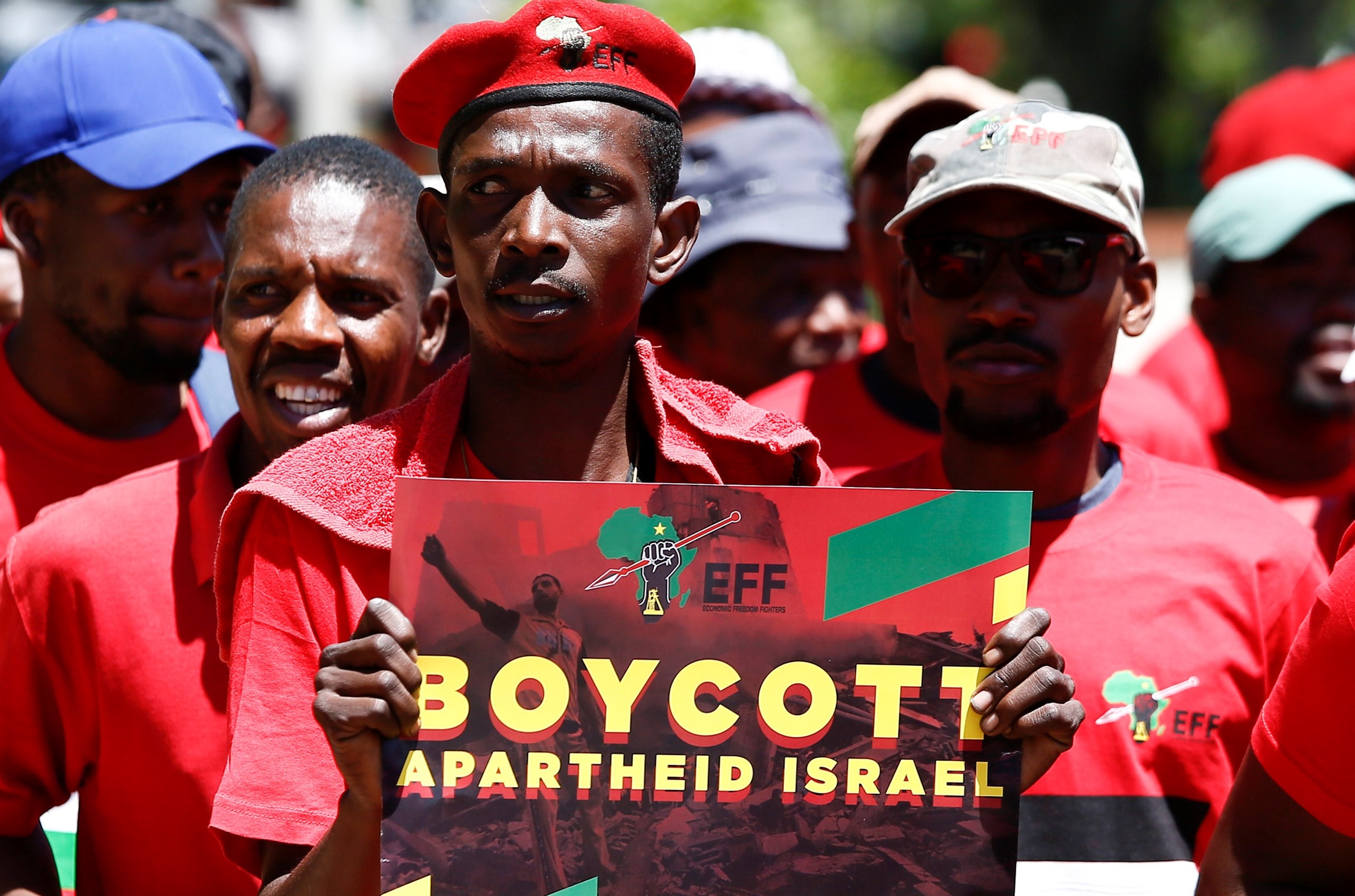  A man holds a sign as South African opposition Party Economic Freedom Fighters (EFF) members demonstrate to express their solidarity with the Palestinians on 2 November, 2017 (AFP)