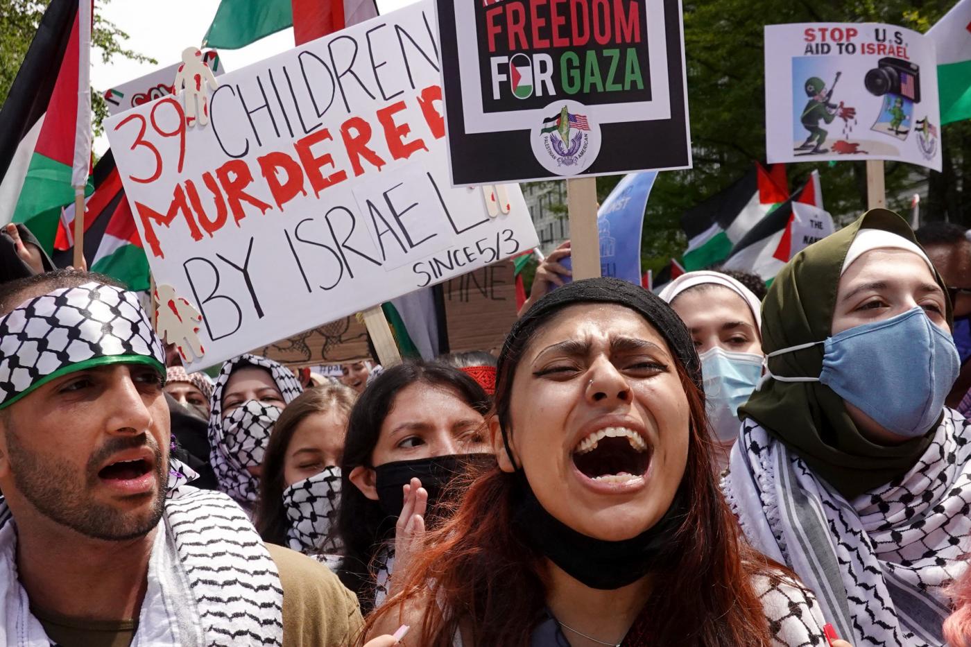 People march through downtown Chicago protesting Israeli air strikes in the Gaza Strip on 16 May 2021 (AFP)