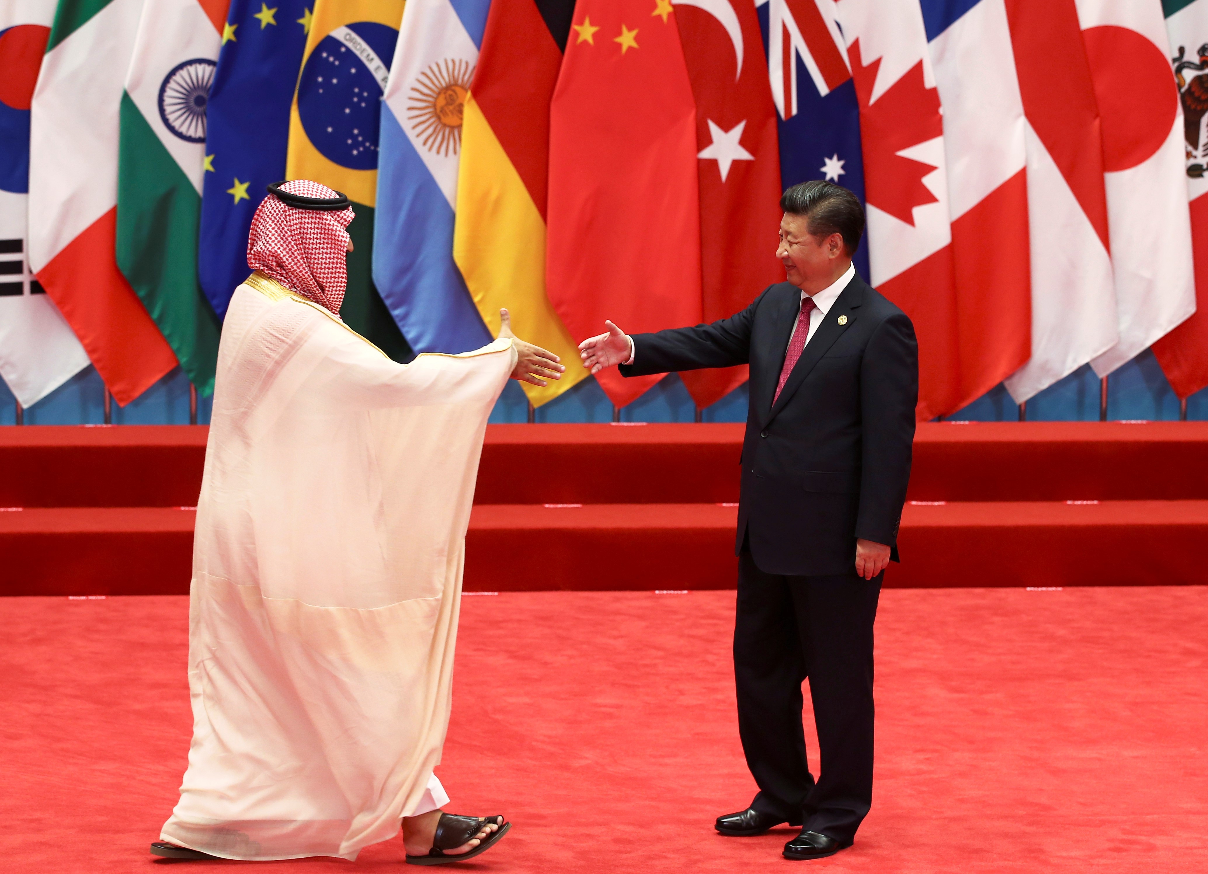 China's President Xi Jinping shakes hands with Crown Prince Mohammed bin Salman during the G20 Summit in Hangzhou, Zhejiang province, China (AFP)