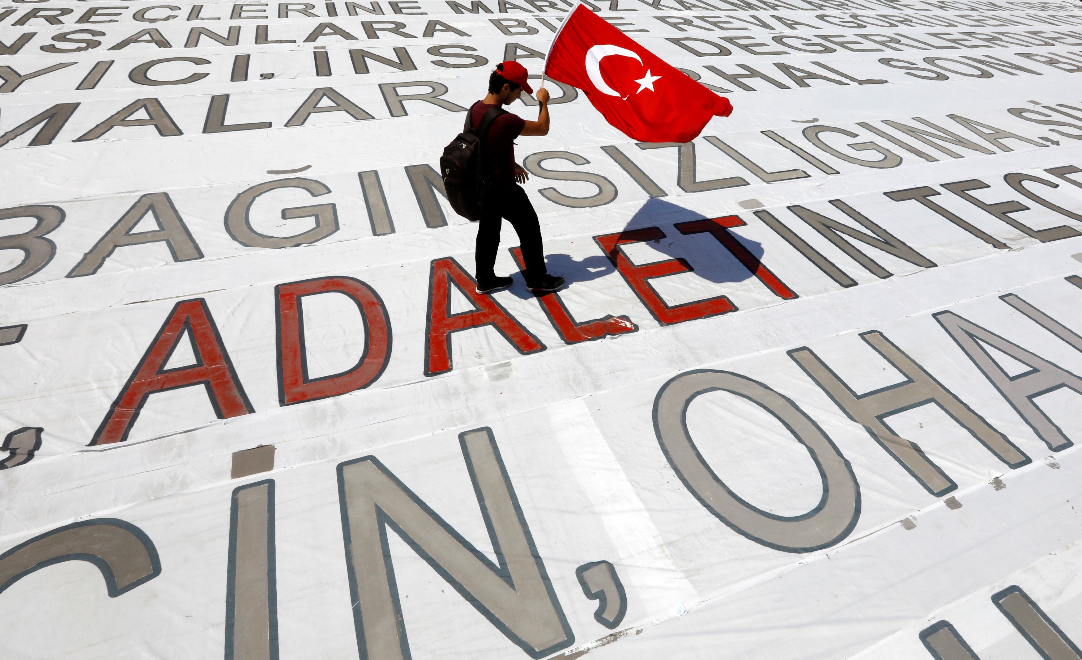 A young man with a Turkish flag during a rally dubbed "Justice March"in Istanbul on 9 July, 2017 (Reuters)