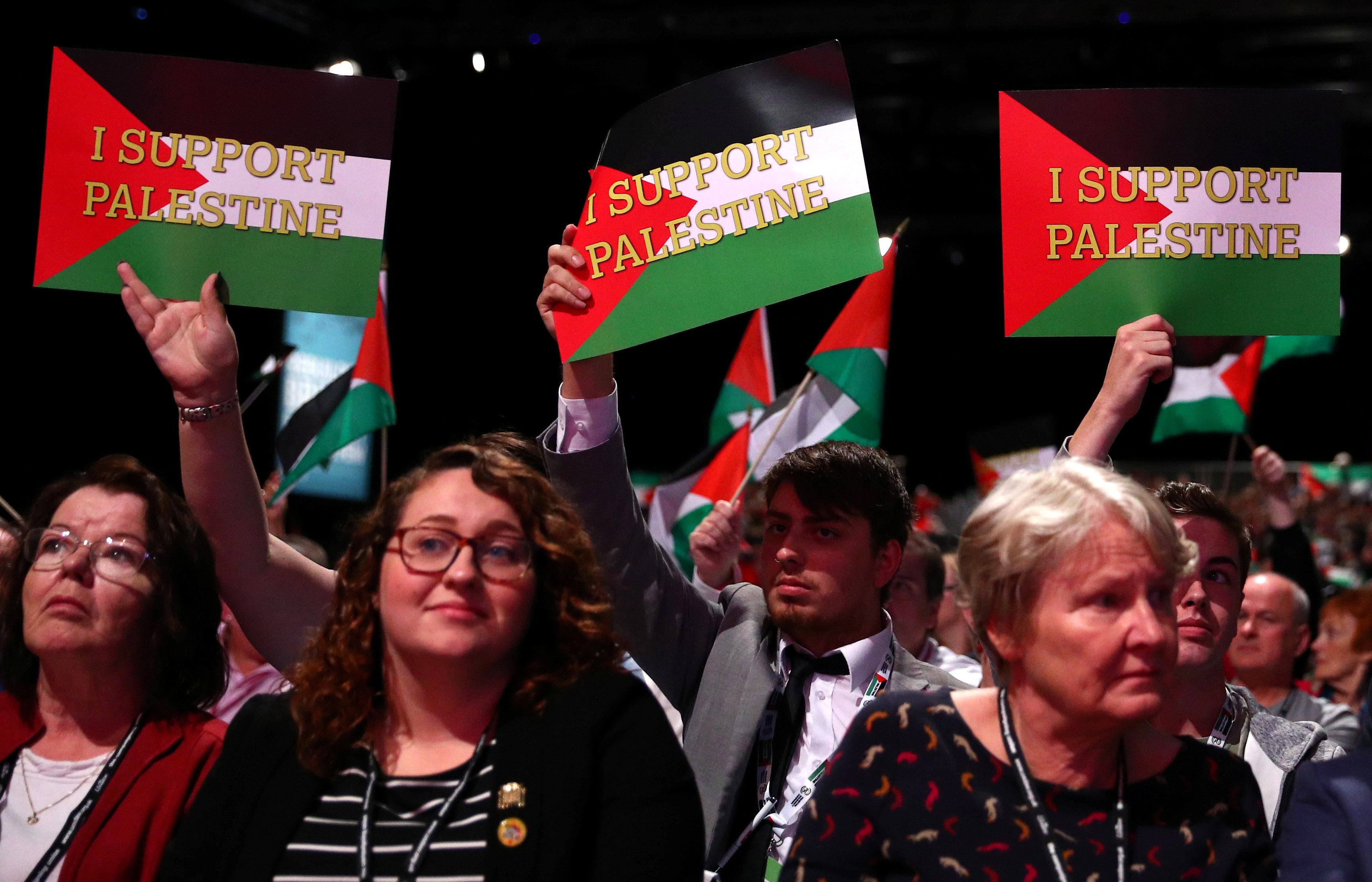 Delegates hold up placards in support of Palestine at the Labour Party's conference in Liverpool, Britain, September 25, 2018. REUTERS/