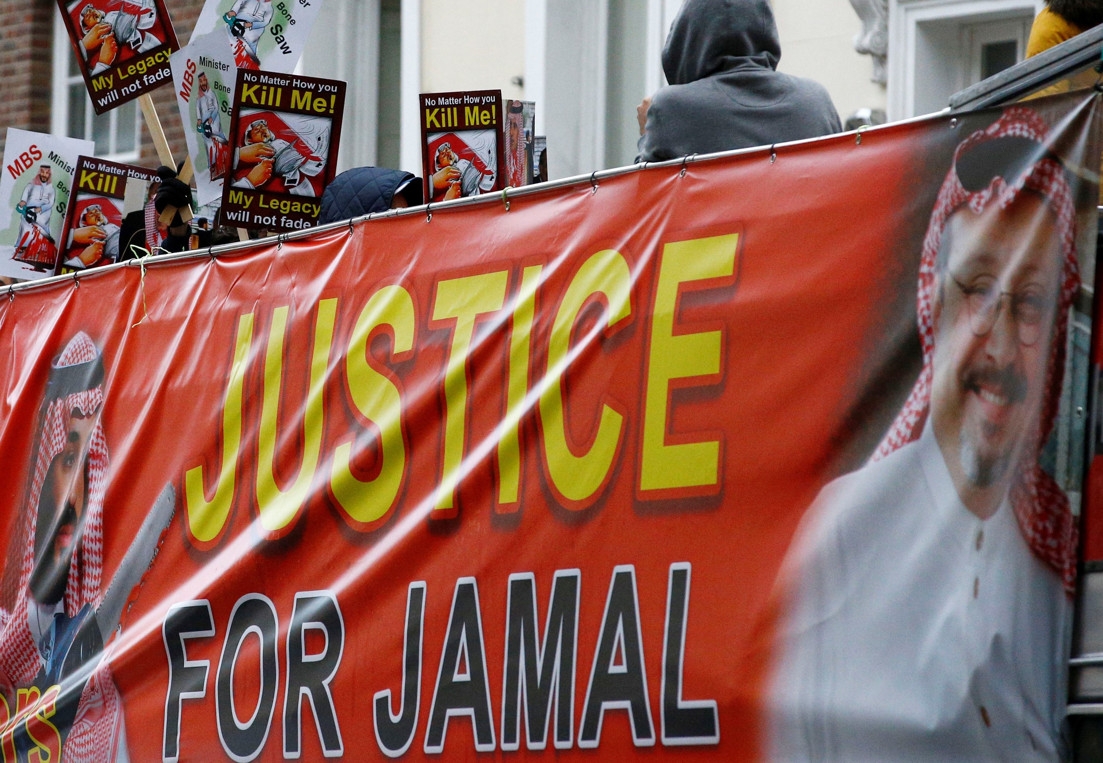 Demonstrators ride the double-decker bus as they attend the Stop The War Coalition protest against the killing of journalist Jamal Khashoggi, London on 25 October (Reuters)