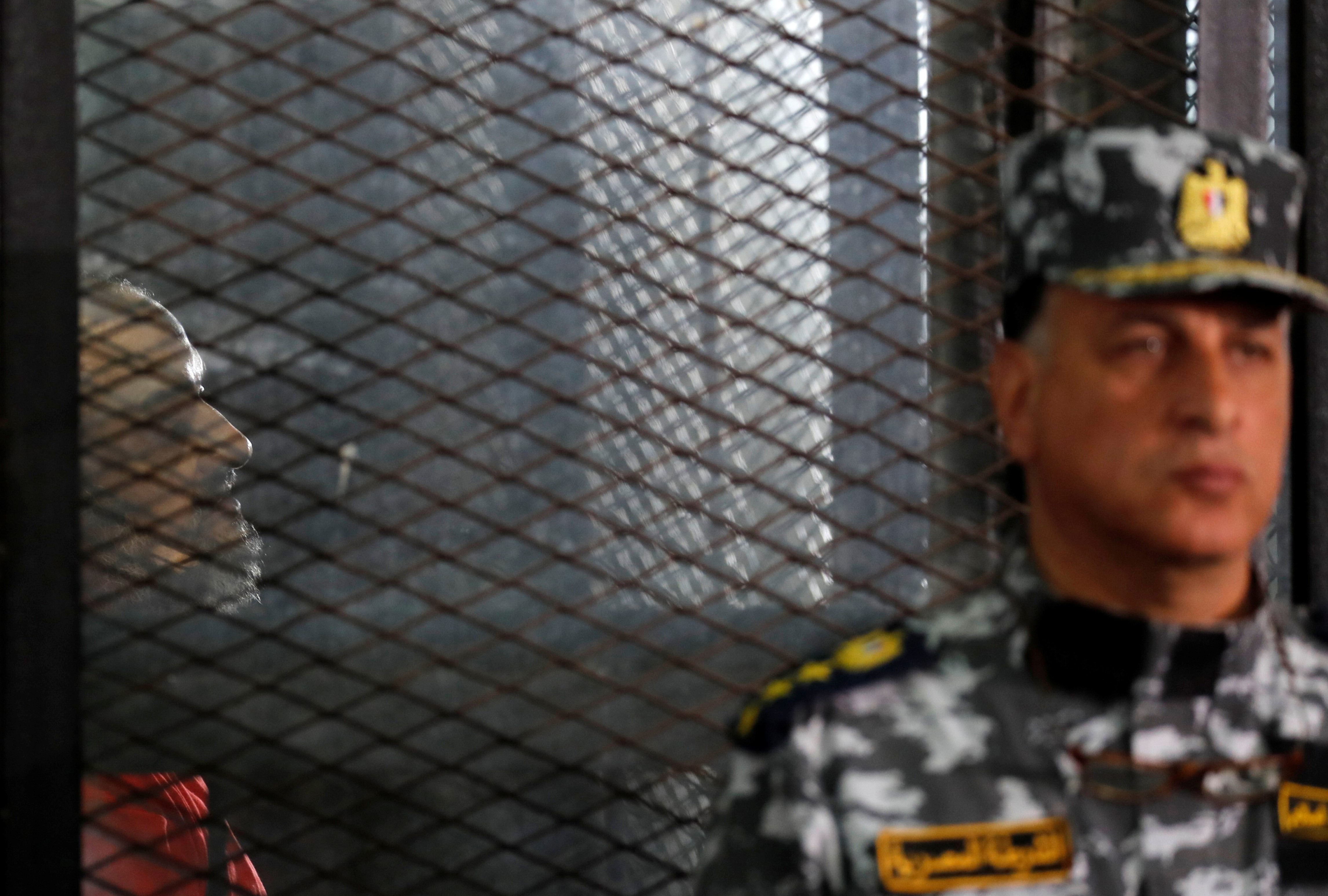 Muslim Brotherhood's senior member Mohamed El-Beltagy is seen behind bars during a court case on 26 December, 2018 (Reuters)