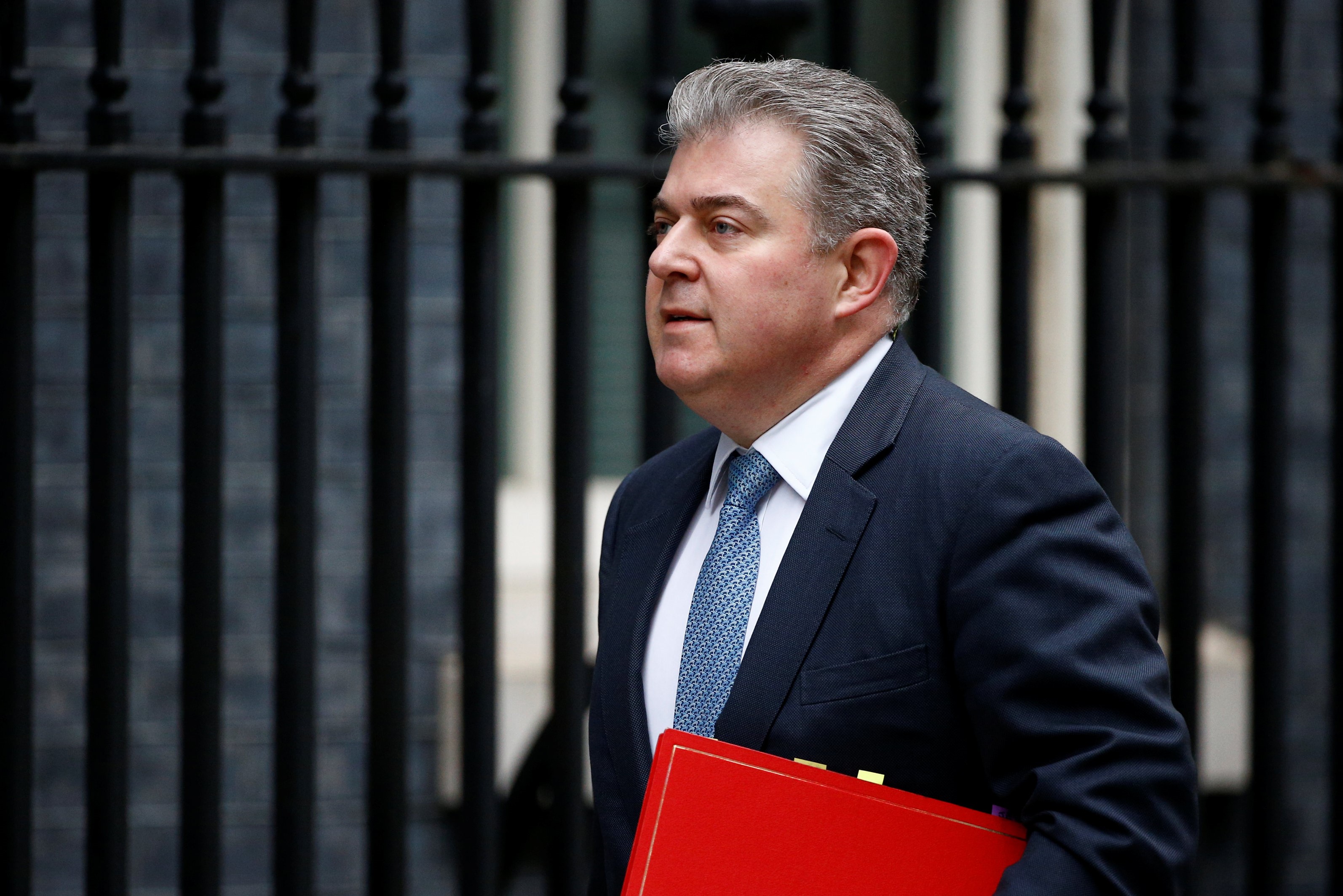 Britain's Conservative Party Chairman Brandon Lewis walks outside Downing Street in London, Britain on 13 March (REUTERS)