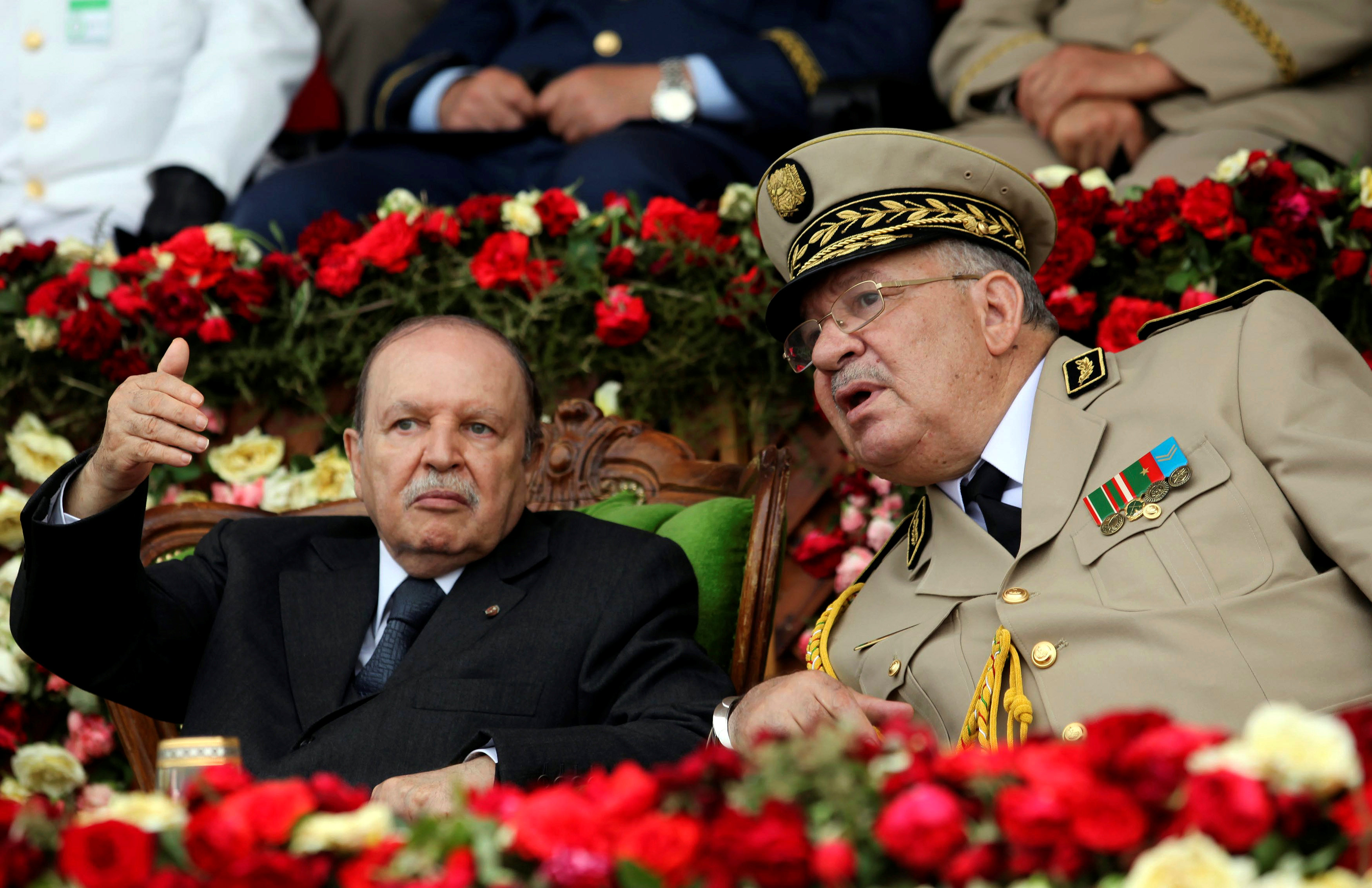 Army Chief of Staff Ahmed Gaid Salah, right, said that Algerian President Abdelaziz Bouteflika, left, is 'unfit to rule' (Reuters)