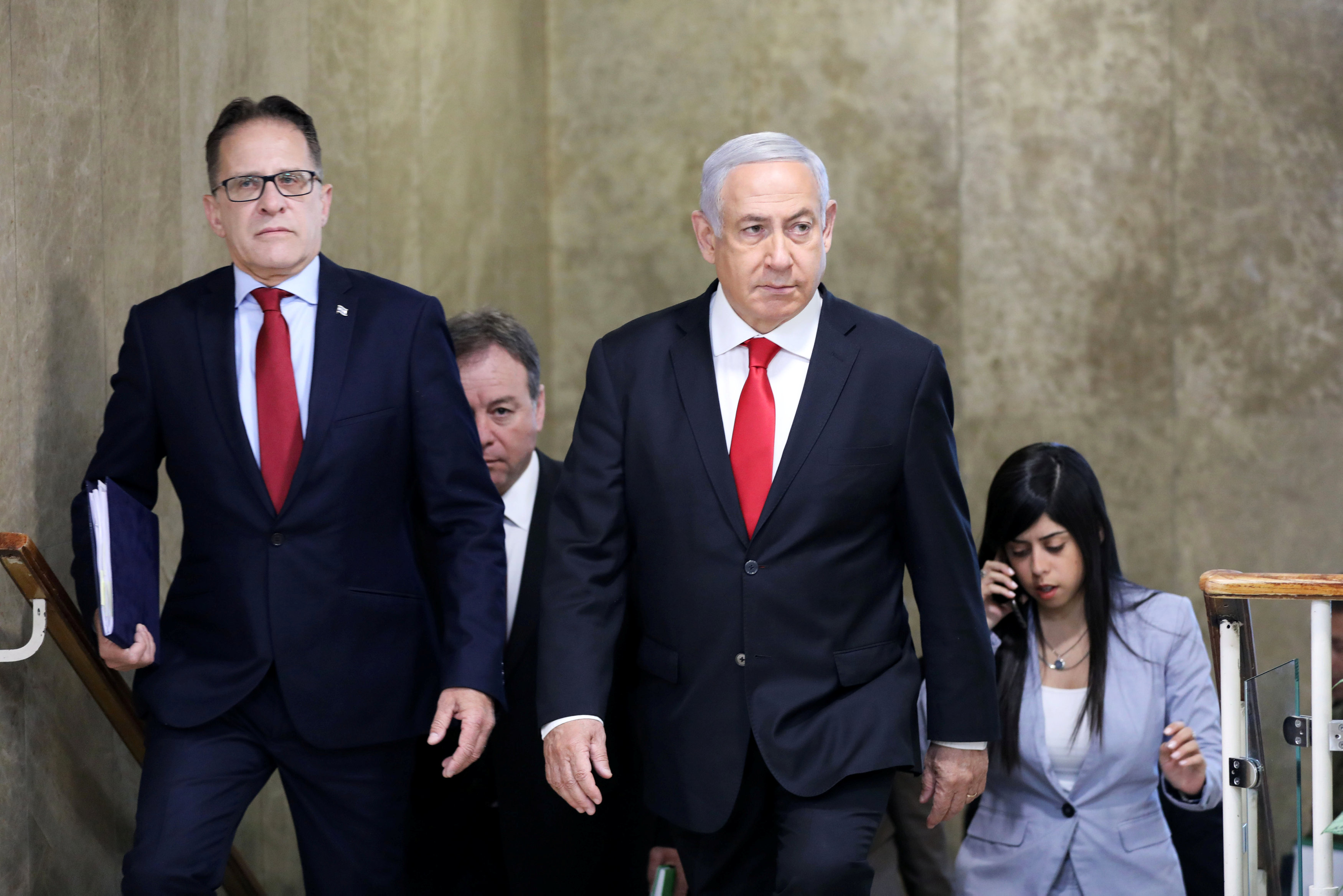 Israeli Prime Minister Benjamin Netanyahu and Cabinet Secretary Tzachi Braverman arrive to attend the weekly cabinet meeting in Jerusalem (Reuters)