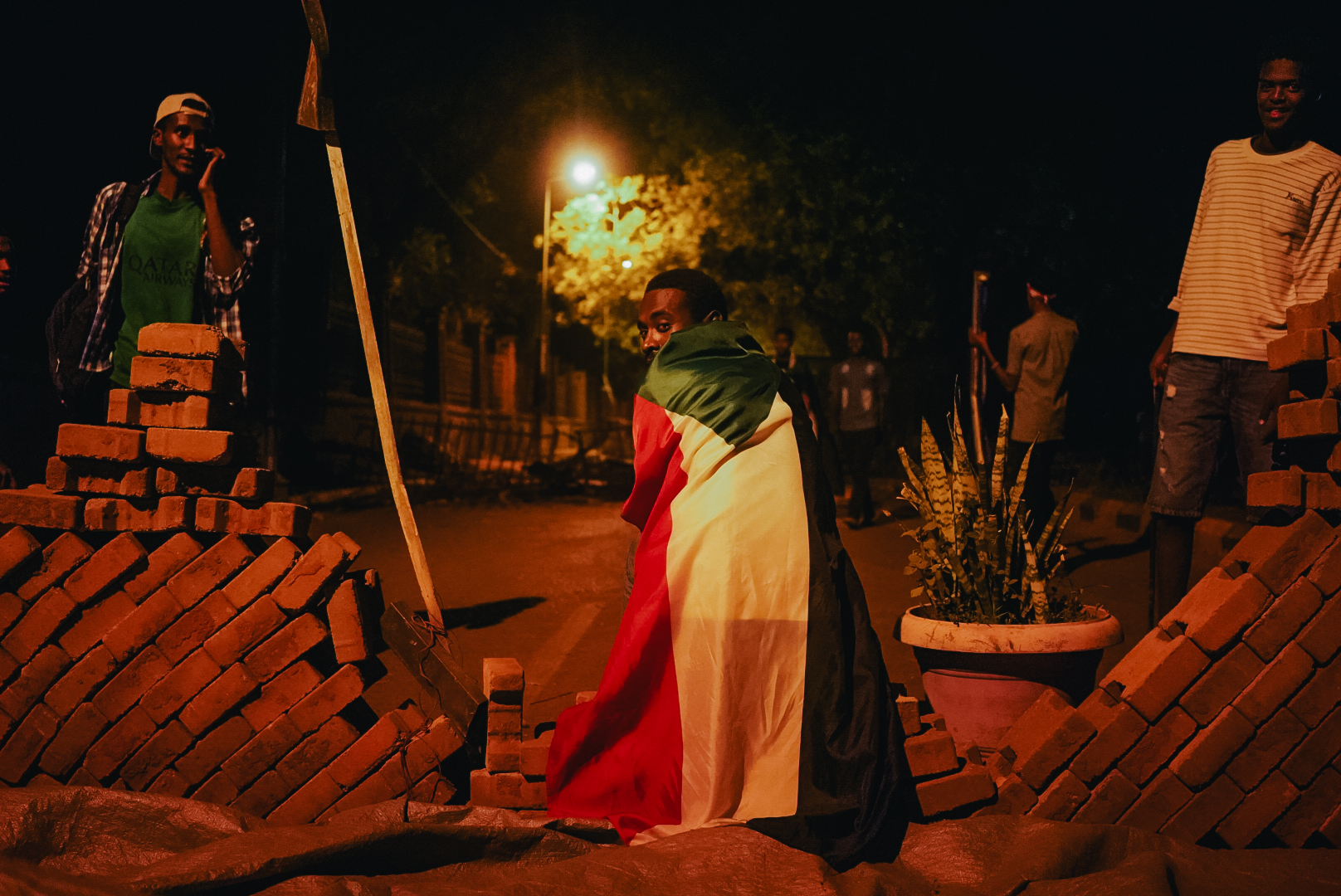 Sudanese protesters have built barricades in the streets near Colombia (MEE/Kaamil Ahmed)