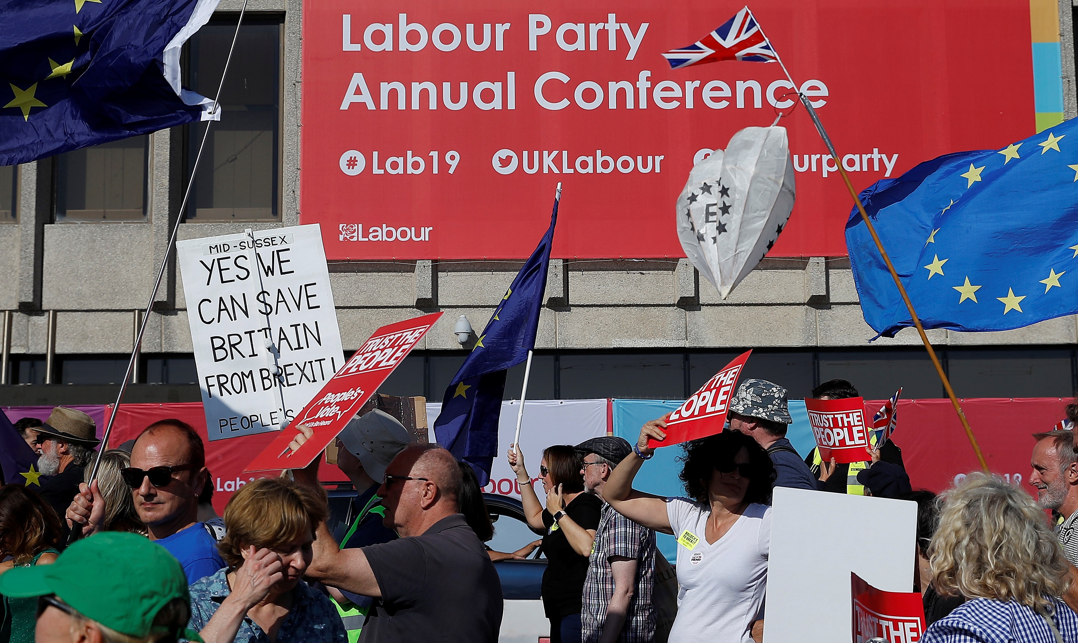 Participants in a People's Vote demonstration walk past the Brighton Centre where the Labour Party Annual Conference is being held, in Brighton, Britain, September 21, 2019.