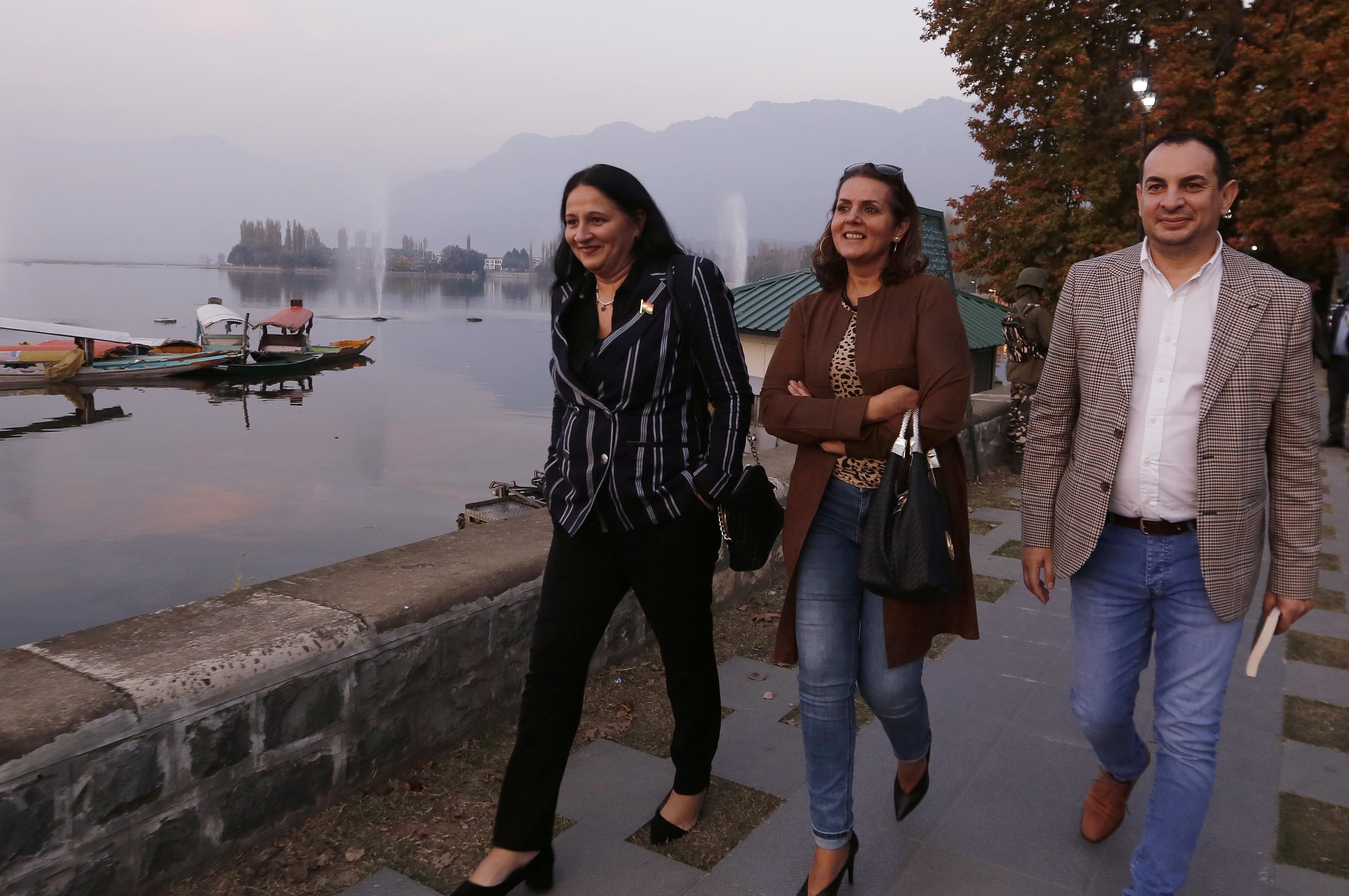 European European Union lawmakers walk on the banks of Dal Lake in Srinagar on 29 October (Reuters)