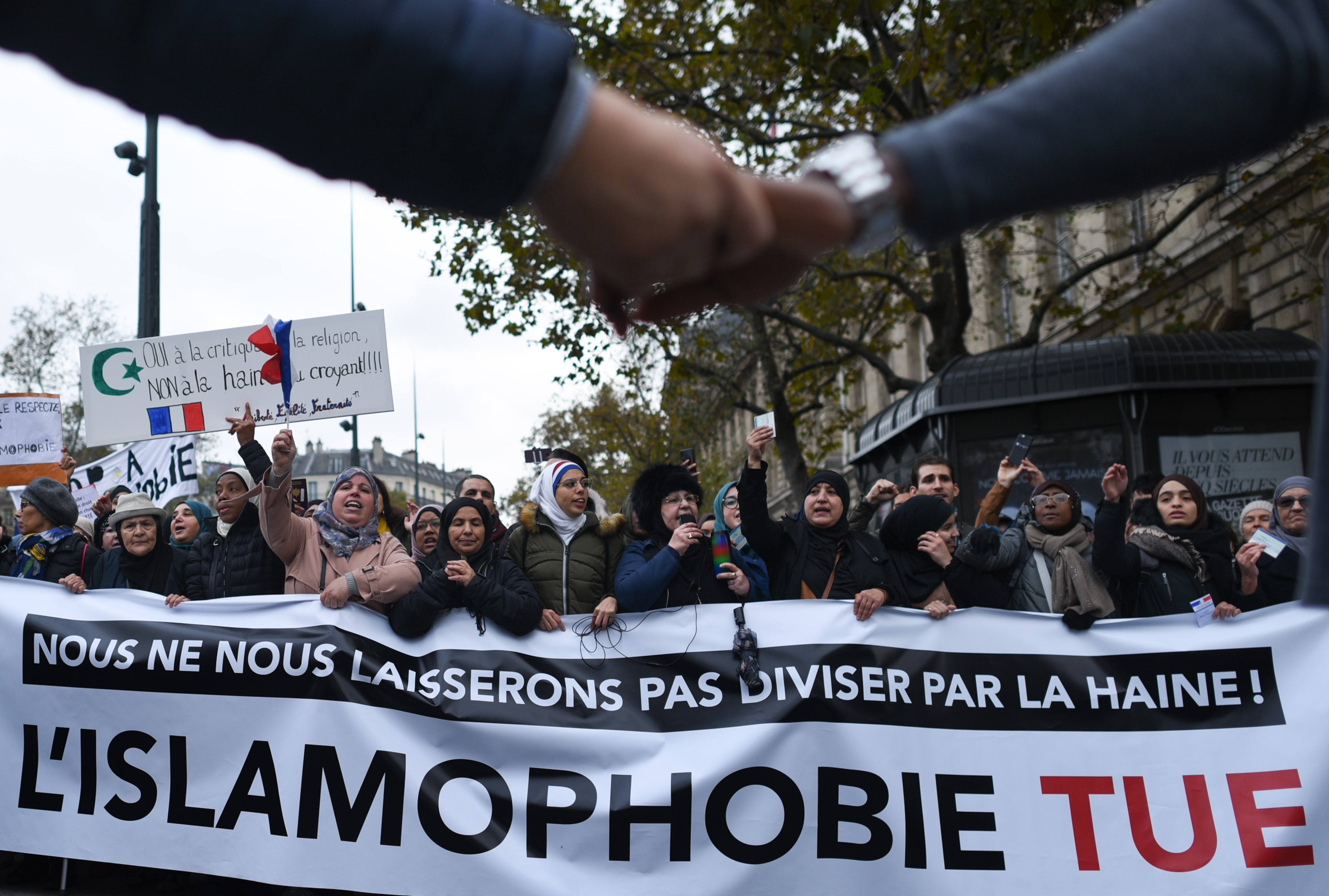 Thousands of people hold a march against islamophobia two weeks after an attack against a mosque in Bayonne and a rise in anti-Islam scaremongering in the French political class. The banner carried by the protesters reads 'Islamophobia kills'. (Reuters)