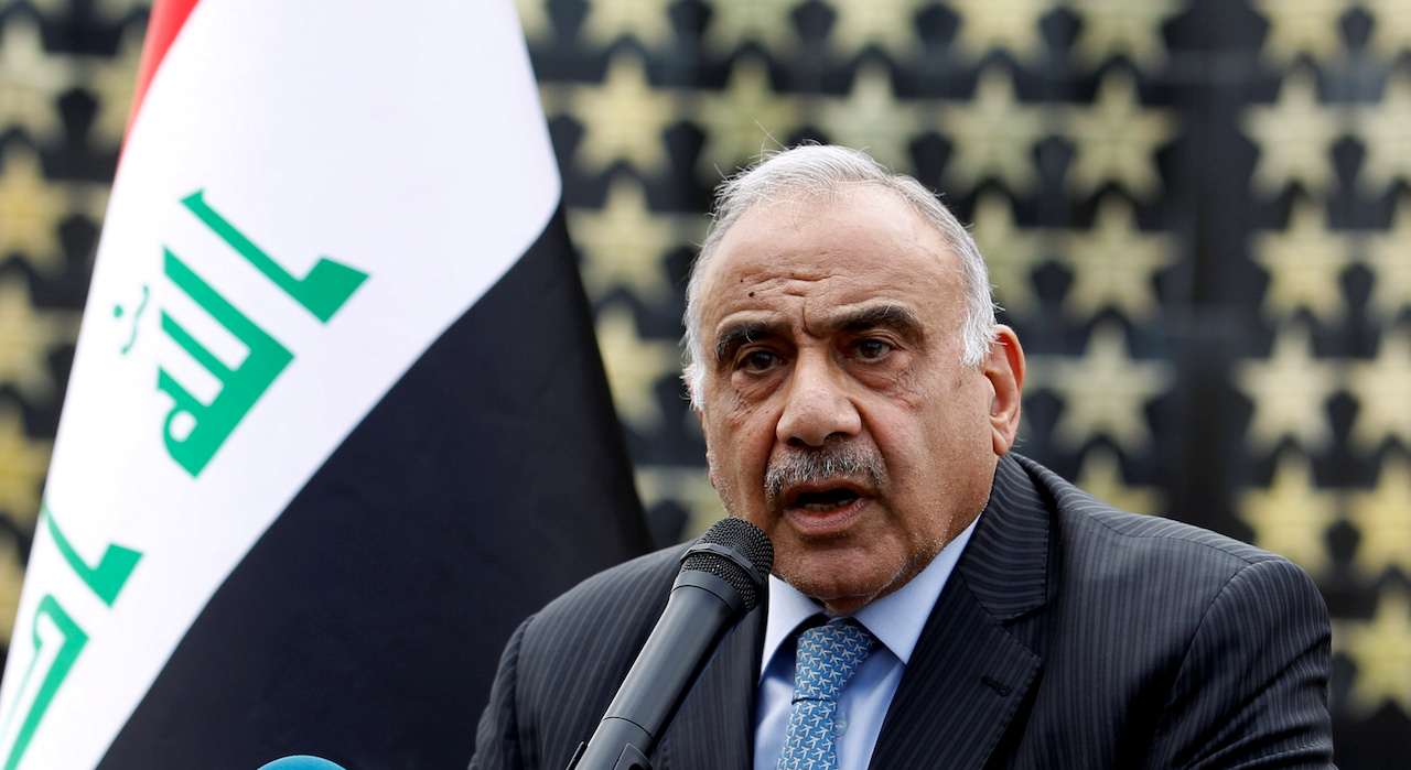 Iraqi Prime Minister Adel Abdul Mahdi speaks during a symbolic funeral ceremony (Reuters)