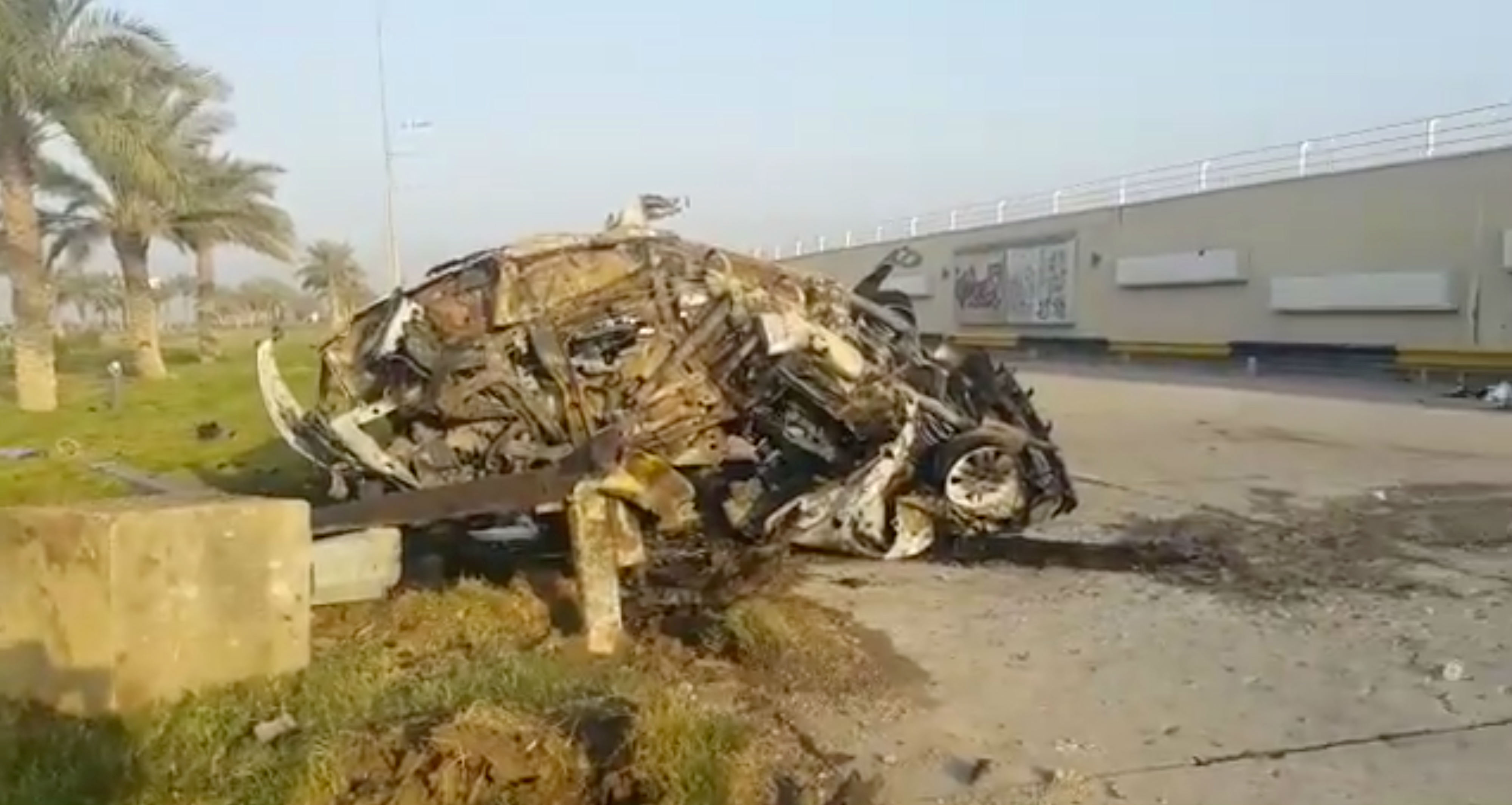 A damaged car, claimed to belong to Qassem Soleimani and Abu Mahdi al Muhandis, is seen near Baghdad International Airport (Reuters)