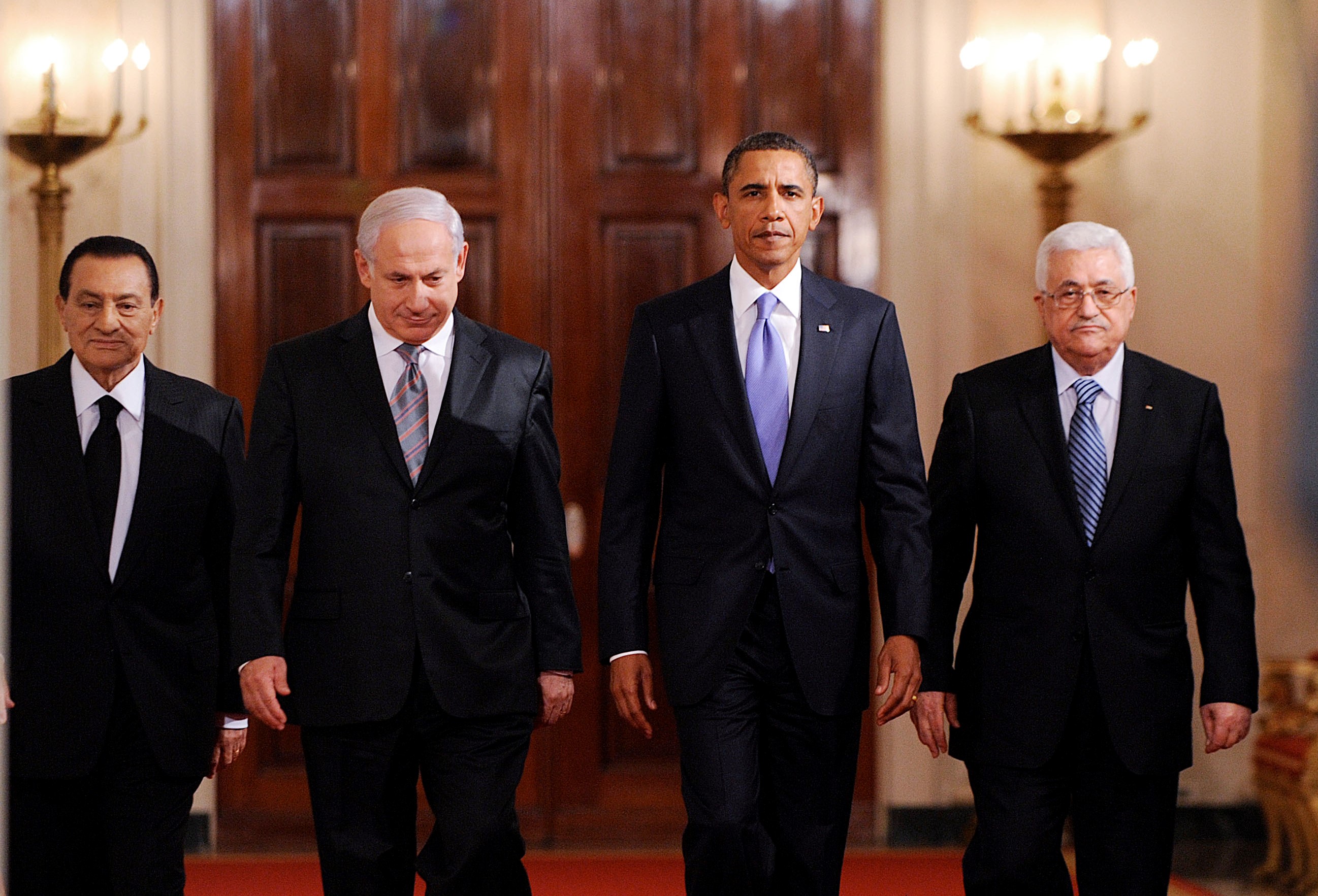   US President Barack Obama walks with Middle East leaders in the East Room of the White House in Washington, DC, USA, on 1 September, 2010 (Reuters)
