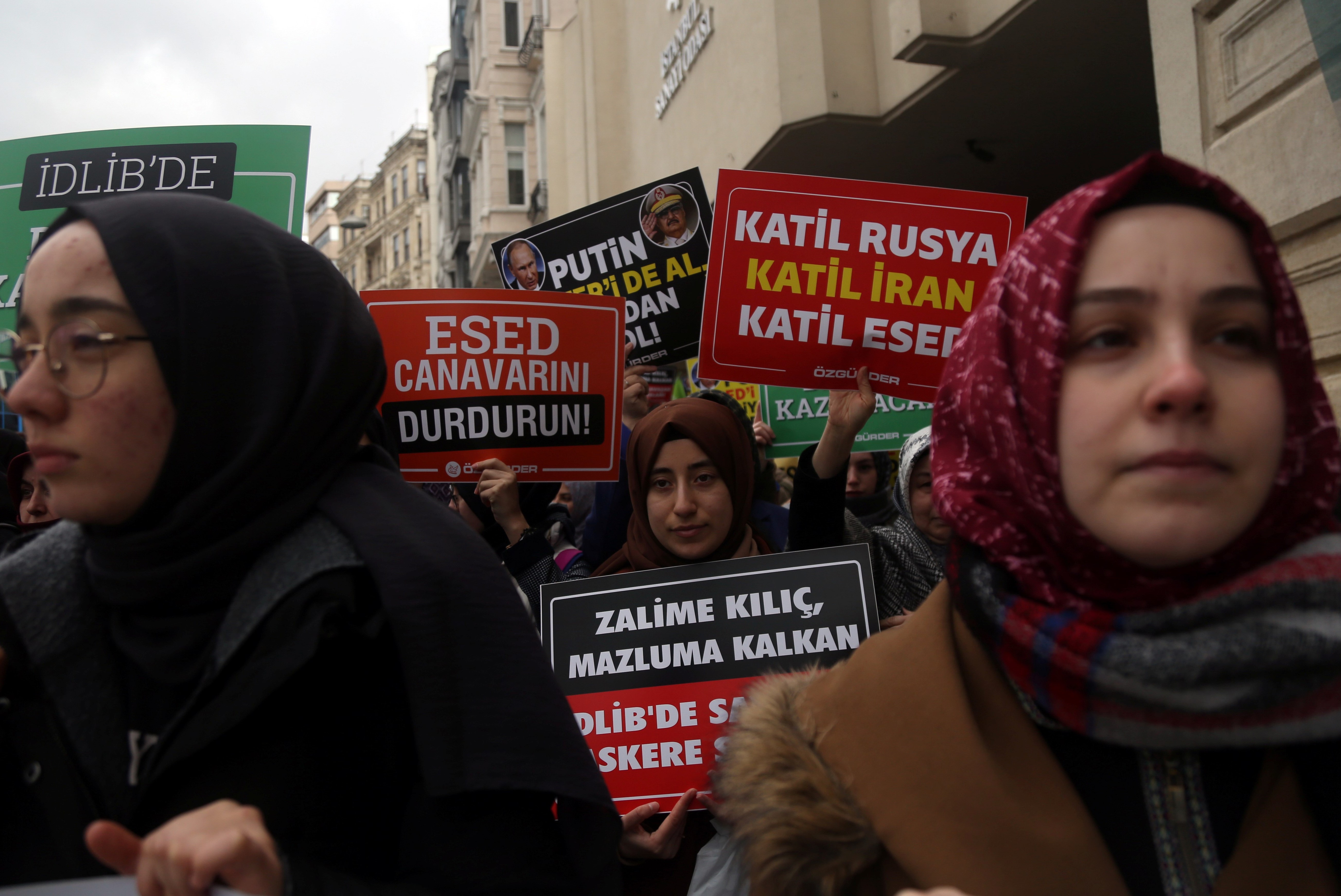 Demonstrators hold placards during a protest against killing of Turkish soldiers in Syria's Idlib region, near the Russian Consulate in Istanbul, Turkey, February 29, 2020