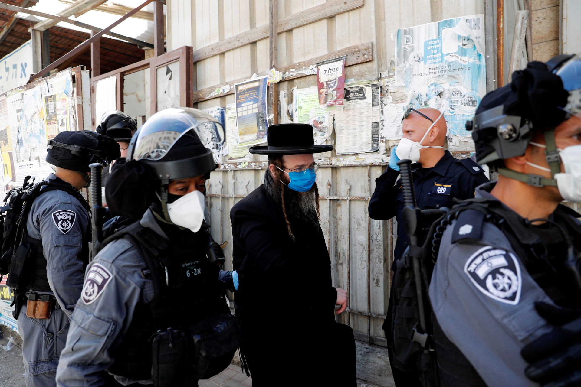 Israeli police detain an Ultra-Orthodox Jewish man for defying government restrictions set in place to curb the spread of the coronavirus disease, in th Mea Shearim neighborhood of Jerusalem (Reuters)