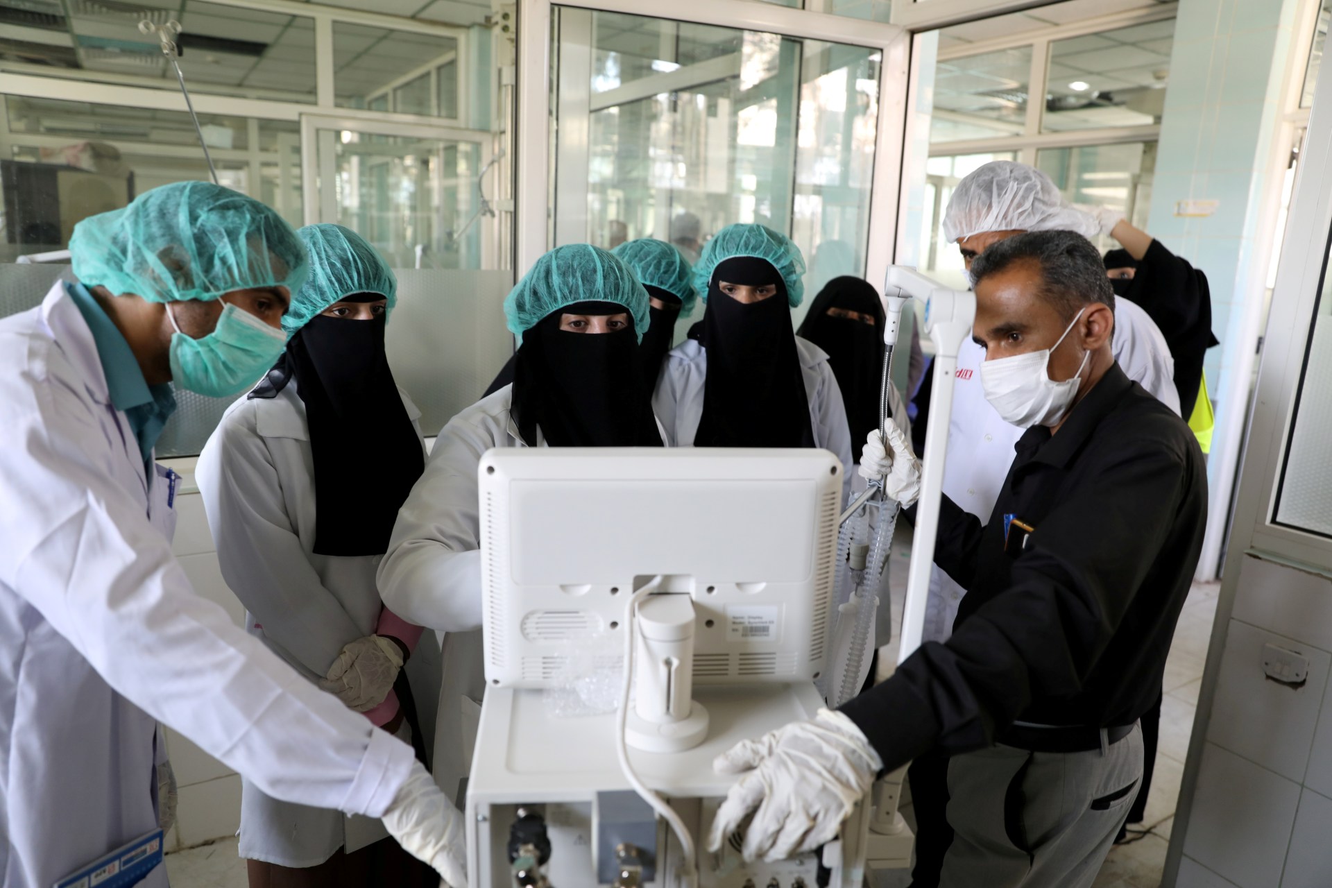 Nurses receive training on using ventilators, recently provided by the World Health Organization, at the intensive care ward of a hospital allocated for novel coronavirus patients in Sanaa (Reuters)