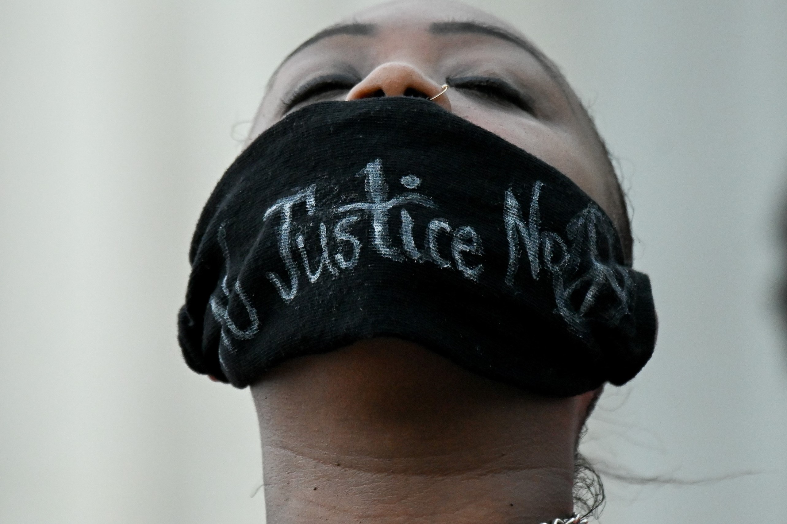 Shenita Binns closes her eyes during a rally against racial inequality in the aftermath of the death in Minneapolis police custody of George Floyd, at the Lincoln Memorial in Washington, U.S. June