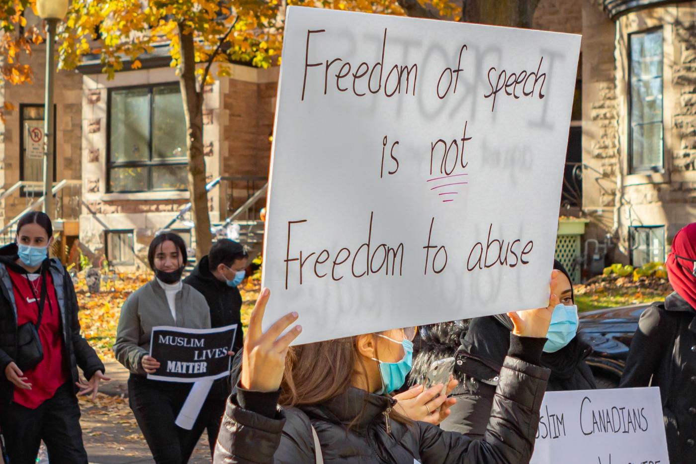 A protest sign reads: "Freedom of speech is not freedom to abuse" in Montreal, Canada, on 31 October (Reuters)