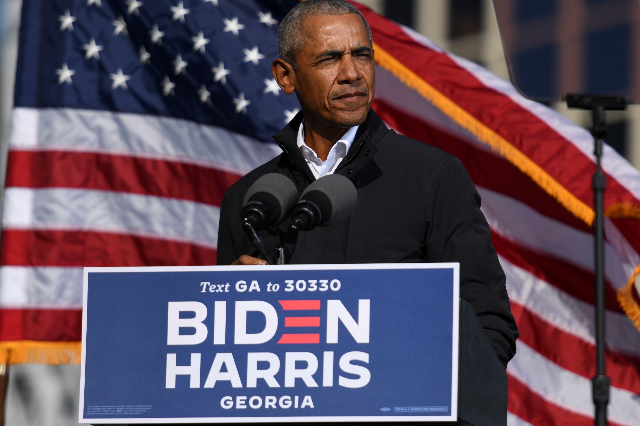 Former President Barack Obama addresses voters one day before the election, in Atlanta, Georgia, U.S.,
