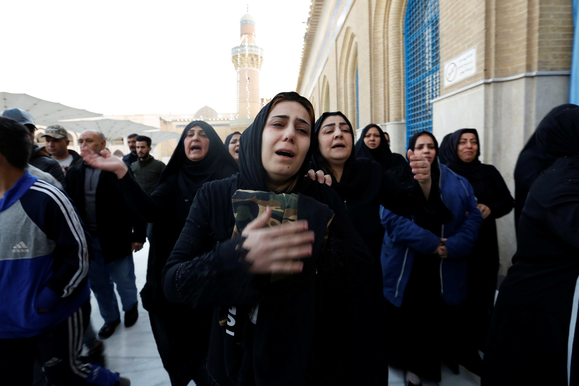 Women mourn during the funeral of a man who was killed in a twin suicide bombing attack in a central Baghdad market, at the shrine of Sheikh Abdul Qadir Jeelani in Baghdad (Reuters)