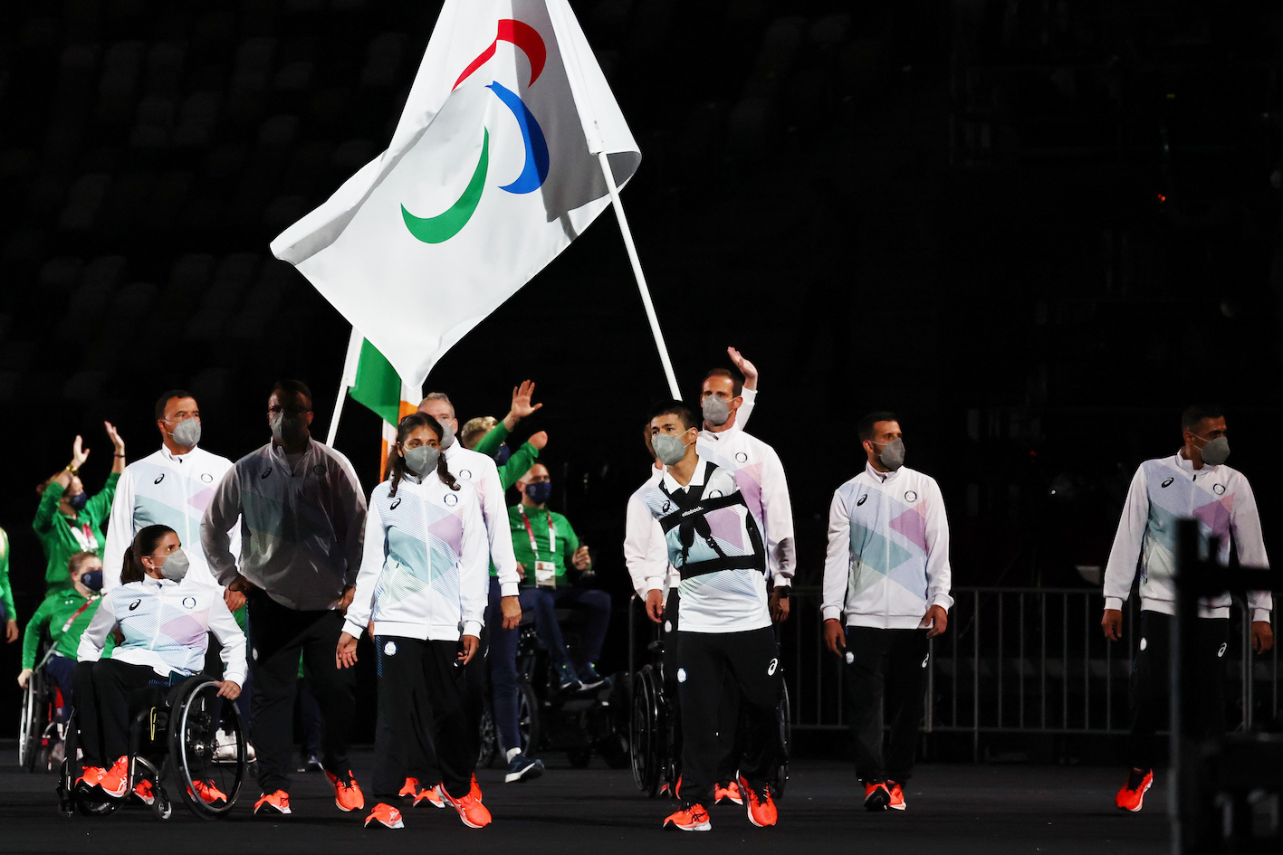Alia Issa of the Refugee Paralympic Team and Abbas Karimi of the Refugee Paralympic Team lead their contingent during the athletes parade at the opening ceremony (Reuter/ Athit Perawongmetha)