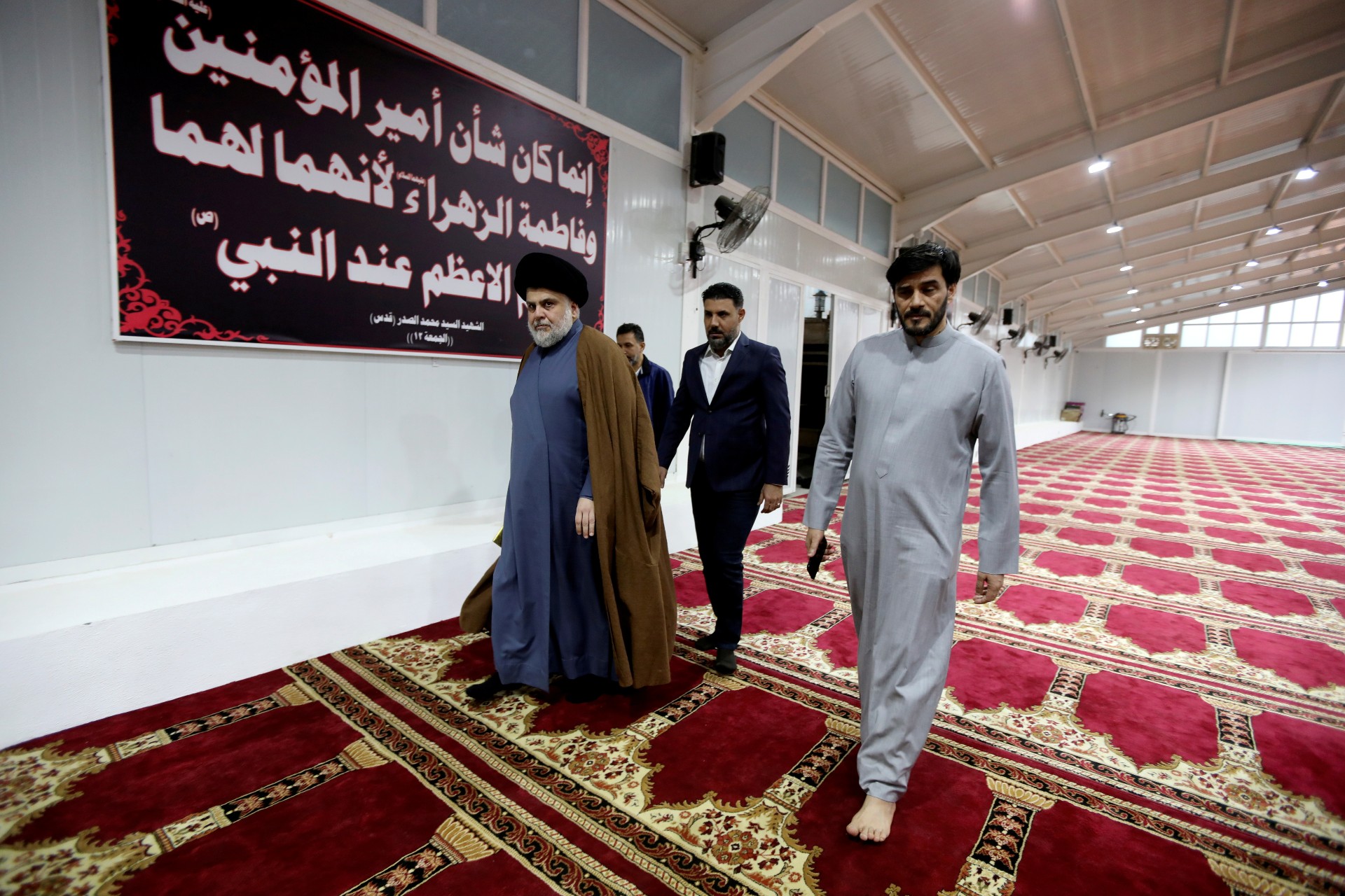 Muqtada al-Sadr attends a news conference in Najaf, Iraq, 18 November (Reuters)