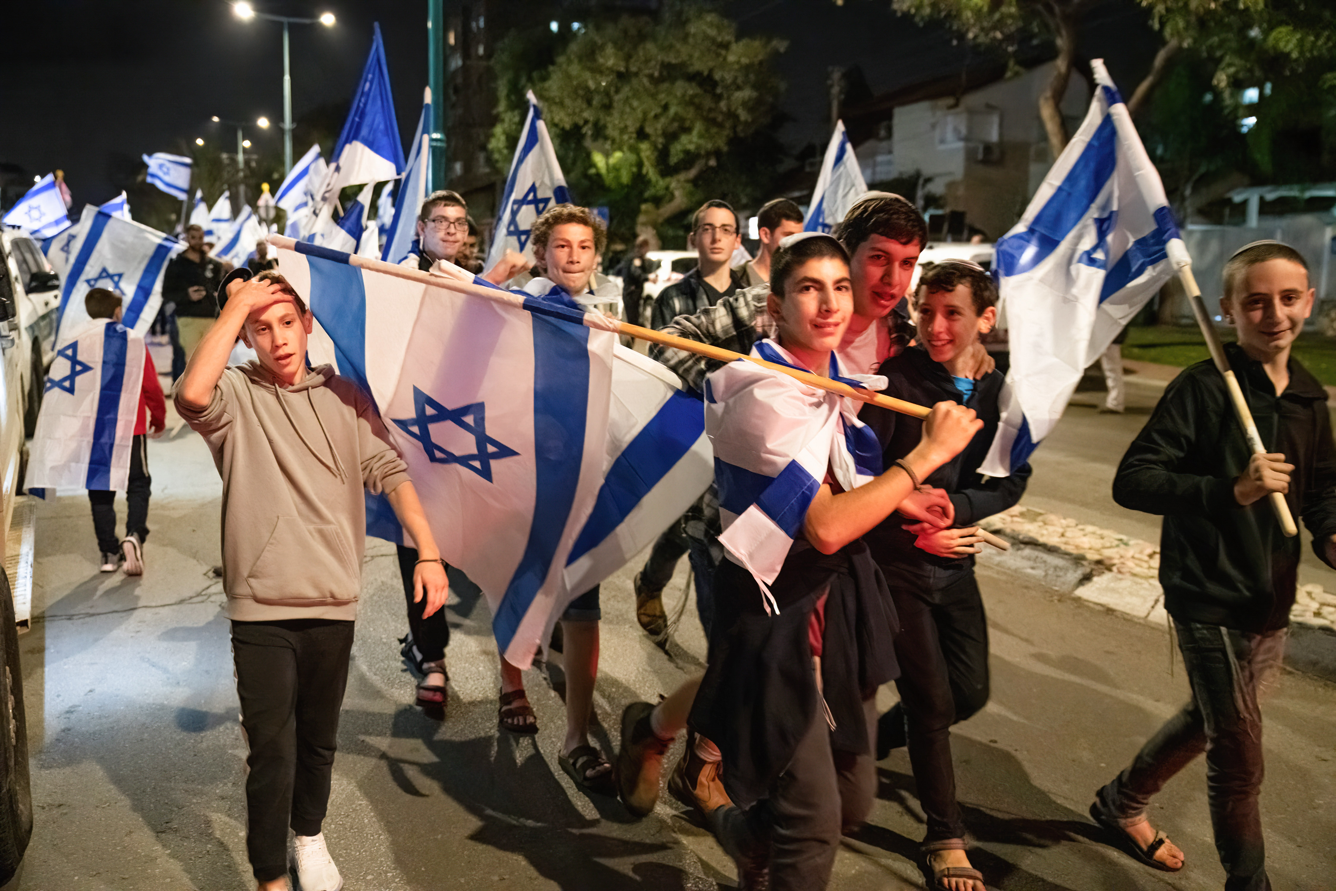 Israeli far-right activists join march through the city of Lydd organised by religious Zionist groups, celebrating the last candle of the holiday of Hanukkah on 5 December 2022 (Reuters)