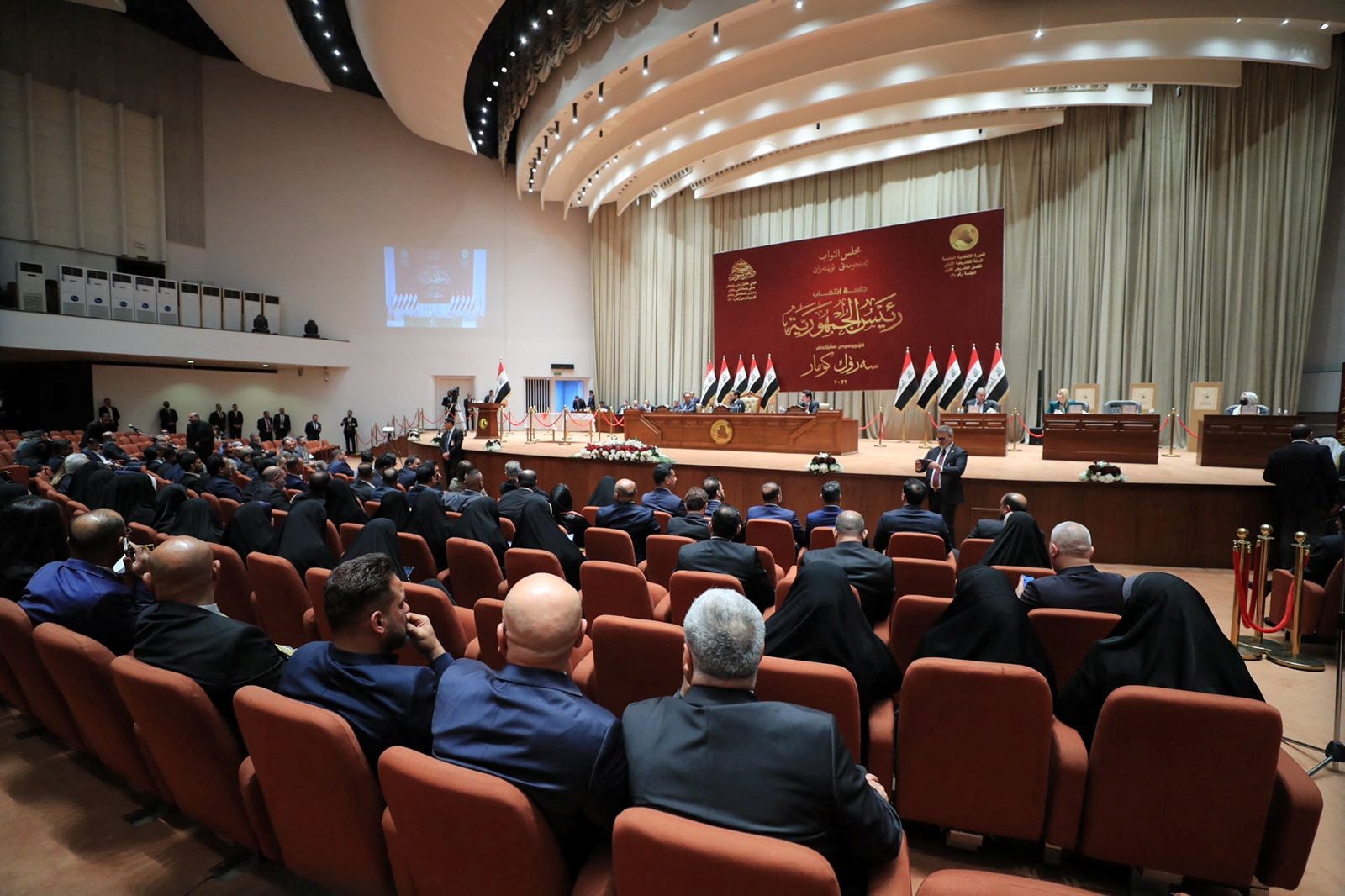 Iraqi lawmakers attend a session of the Iraqi parliament in Baghdad, Iraq, 26 March (Reuters)