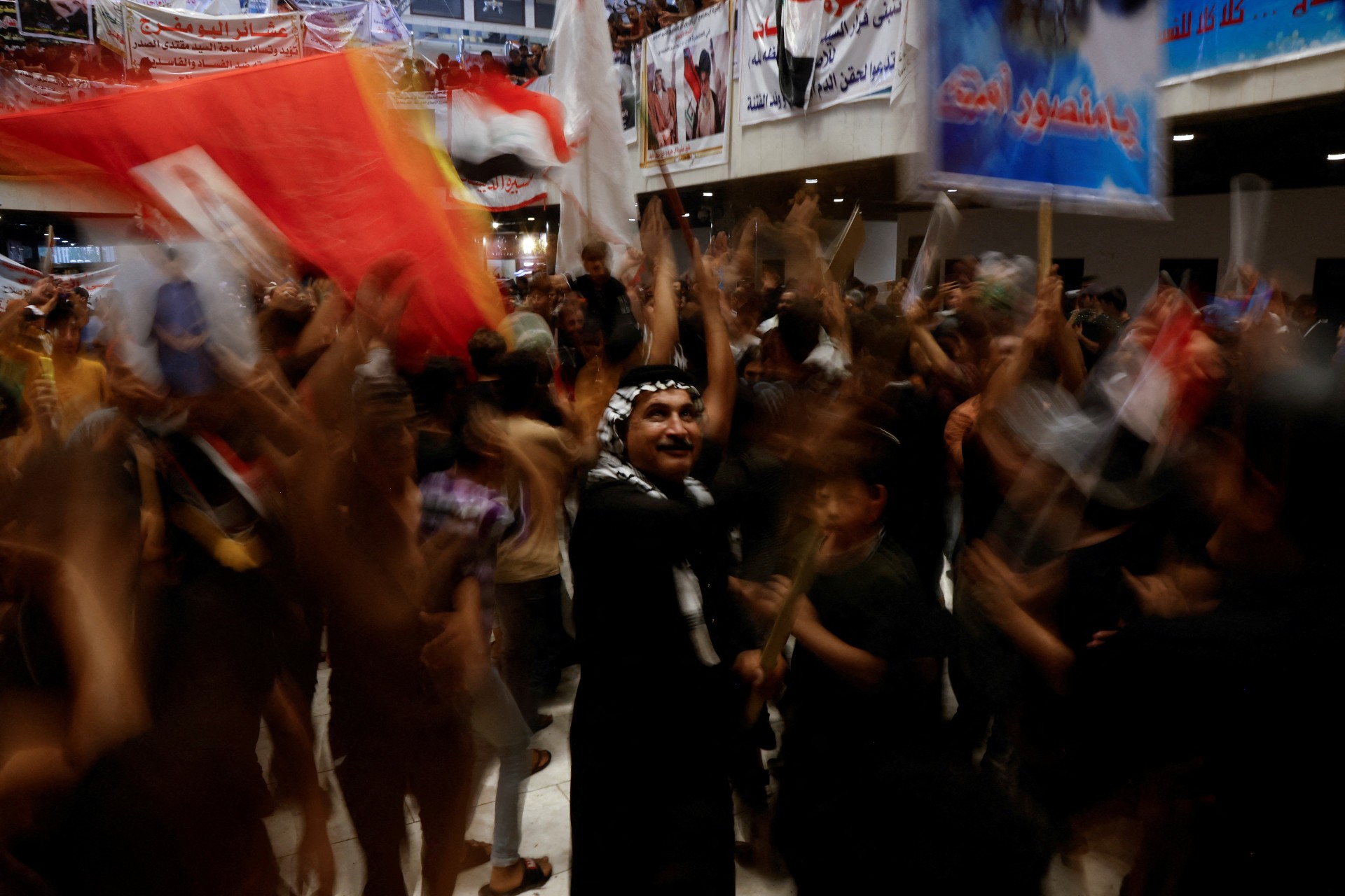 Supporters of Muqtada al-Sadr gather during a sit-in at the parliament building in Baghdad, 3 August (Reuters)