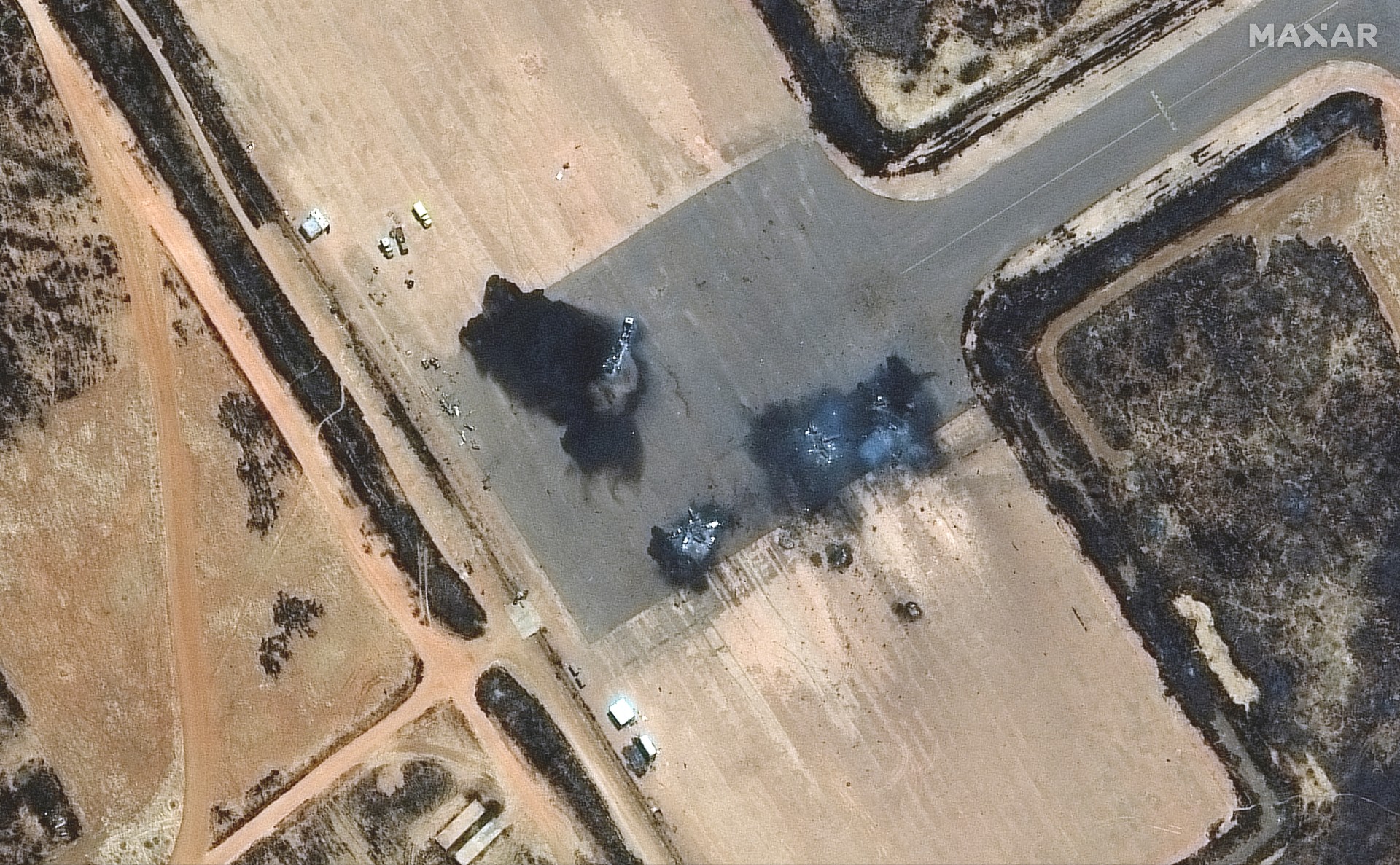 A satellite image shows a close up of destroyed Su-25 ground attack aircraft at El Obeid airbase, Sudan, 18 April (Reuters)