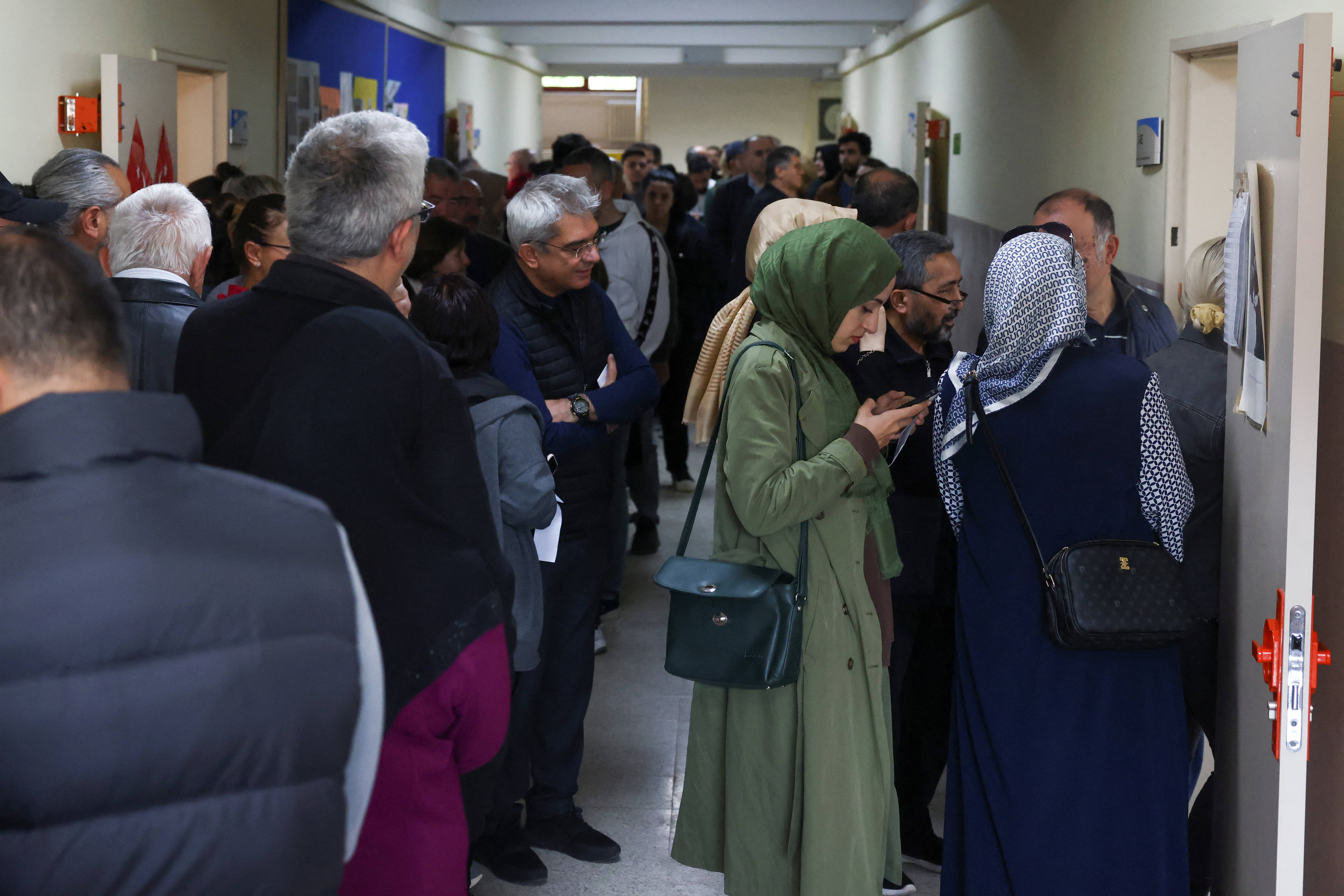 People queue up to vote in the Turkish presidential and parliamentary elections at a polling station in Ankara, Turkey 14 May 2023 (Reuters)