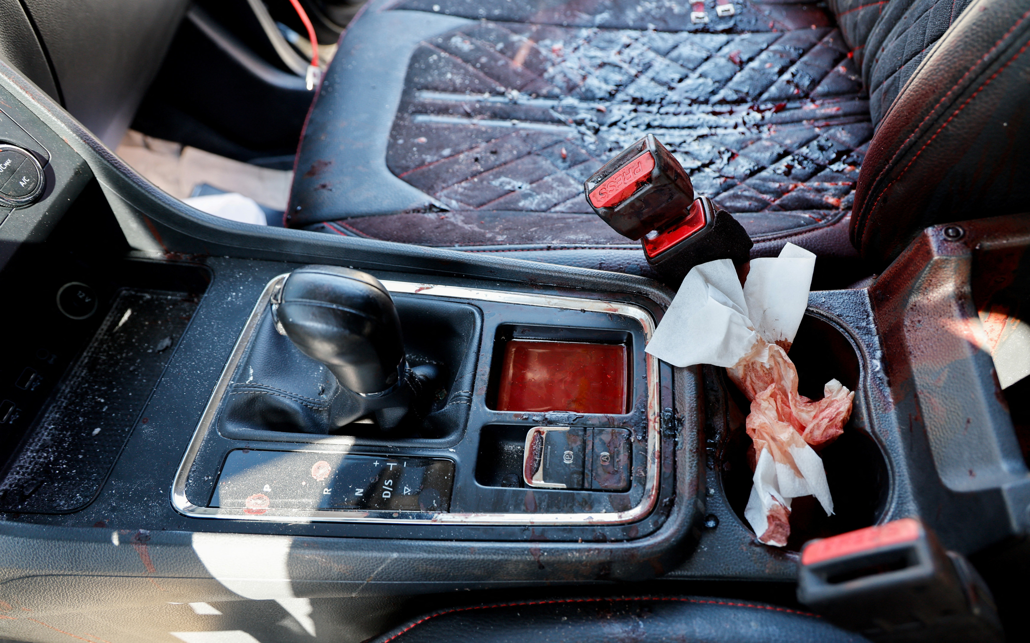 A view of the inside of the car in which an 18-year-old Palestinian was killed by Israeli troops, in Sebastia near Nablus on 22 July 2023 (Reuters)