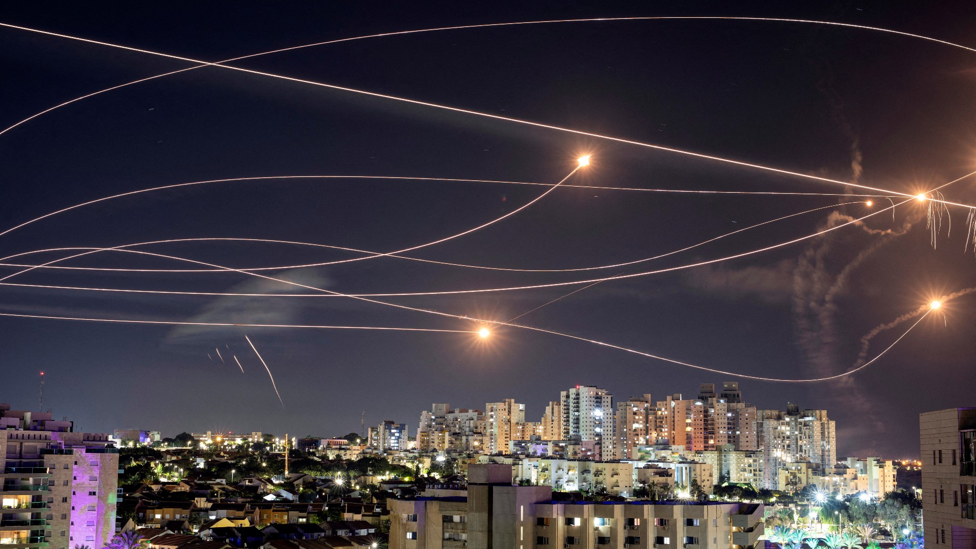 Israel's Iron Dome anti-missile system intercepts rockets launched from the Gaza Strip, as seen from Ashkelon, 20 October (Reuters)