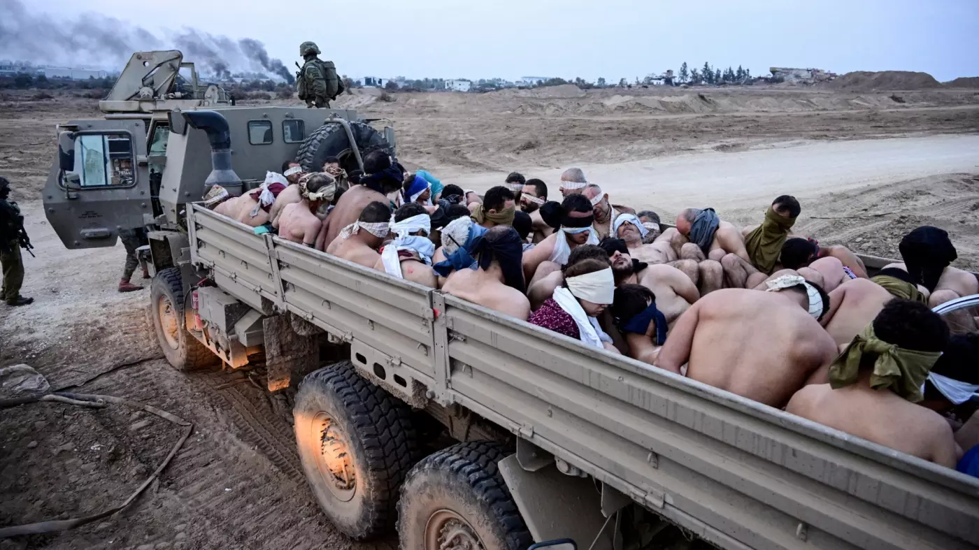 israeli soldiers with shirtless palestinian detainees