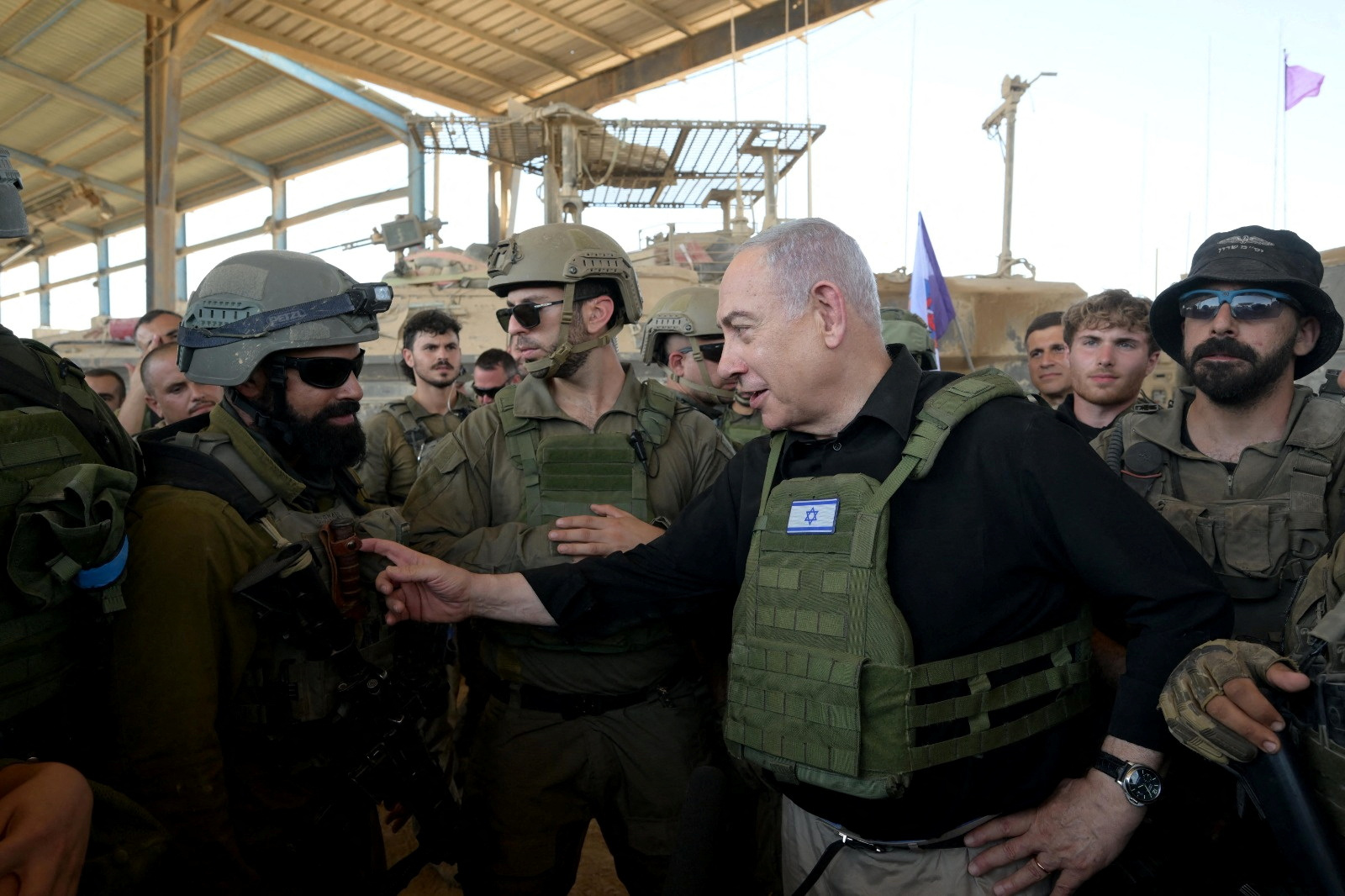 Israeli Prime Minister Benjamin Netanyahu visits Israeli soldiers in Rafah, in the southern Gaza Strip, in this handout picture from July 18, 2024. Avi Ohayon/GPO/Handout via Reuters