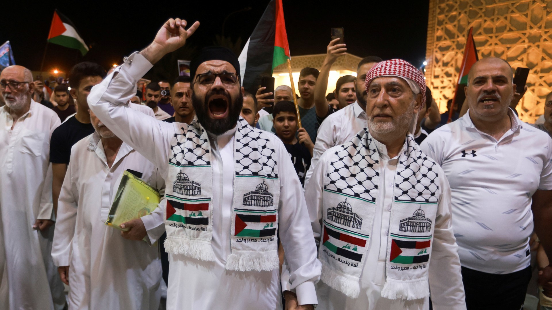 Iraqi people attend a march to condemn the killing of late Hamas leader Ismail Haniyeh in Iran, in Baghdad, Iraq, July 31, 2024. REUTERS/Ahmed Saad