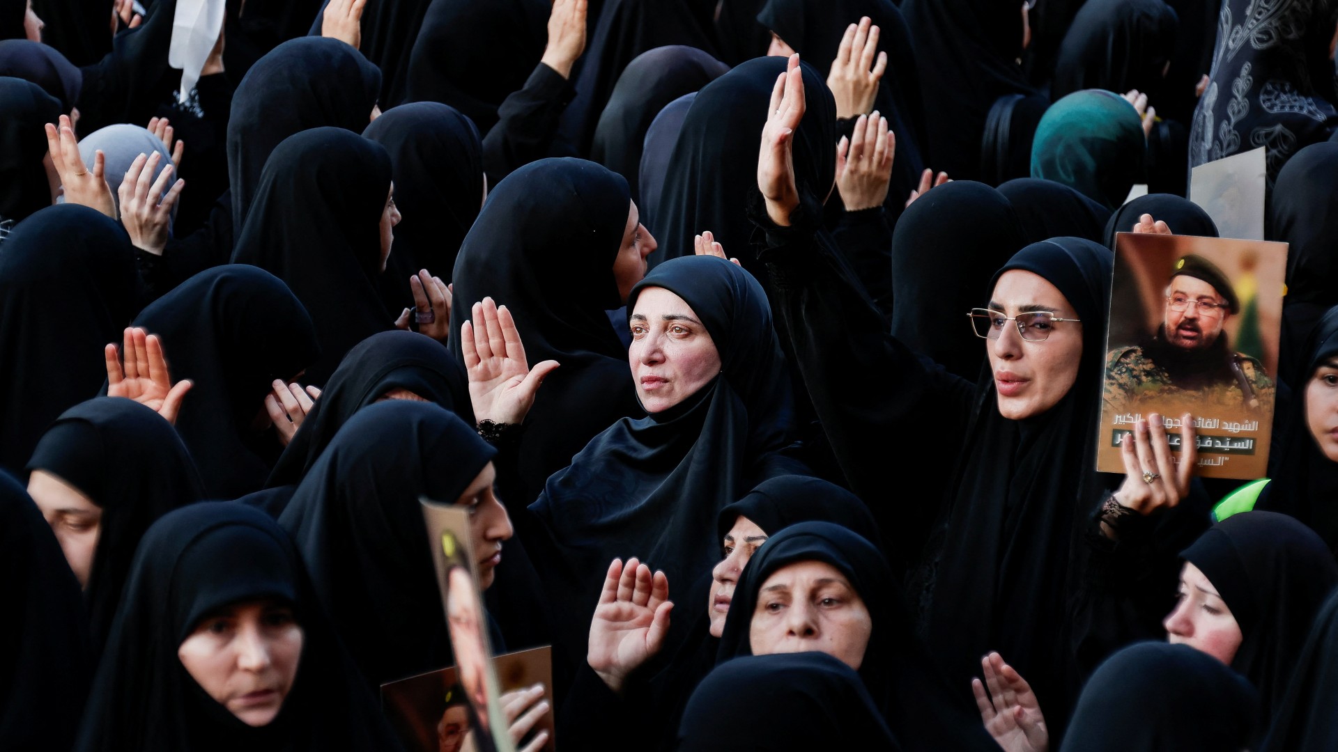 Women mourn and pray during the funeral of Hezbollah senior commander Fuad Shukr, who was killed in an Israeli strike, in Beirut's southern suburbs, Lebanon 1 August (Alkis Konstantinidis/Reuters)