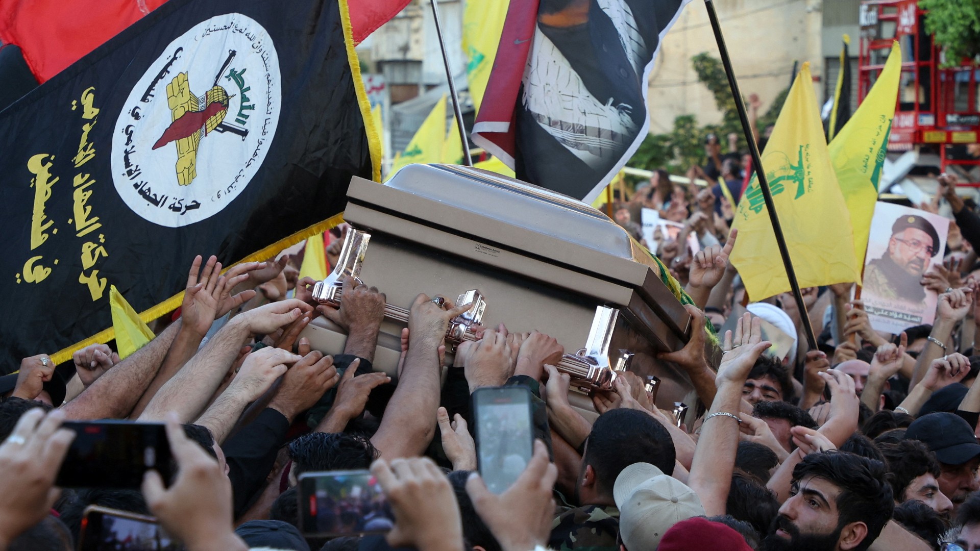 Mourners carry the coffin of Hezbollah senior commander Fuad Shukr, who was killed on Tuesday in an Israeli strike, during his funeral, Lebanon 1 August 2024 (Mohamed Azakir/Reuters)