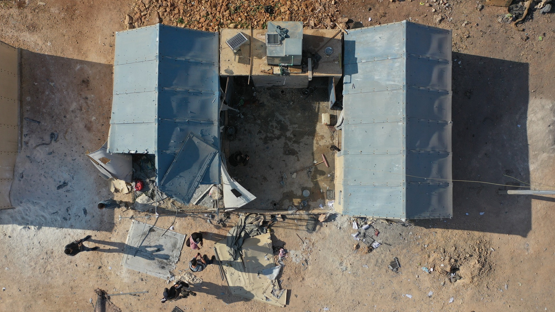 An aerial photo showing a tent damaged by government bombing on 6 November 2022 near the village of Kafr Jalis in the rebel-held Idlib province in northwestern Syria (Syrian Civil Defence)