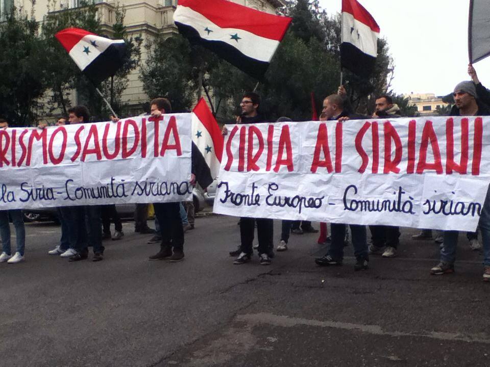 A demonstration in support of Assad by the ESFS in 2014, holding a banner saying "Syria for Syrians" (Fronte Europeo per la Siria)