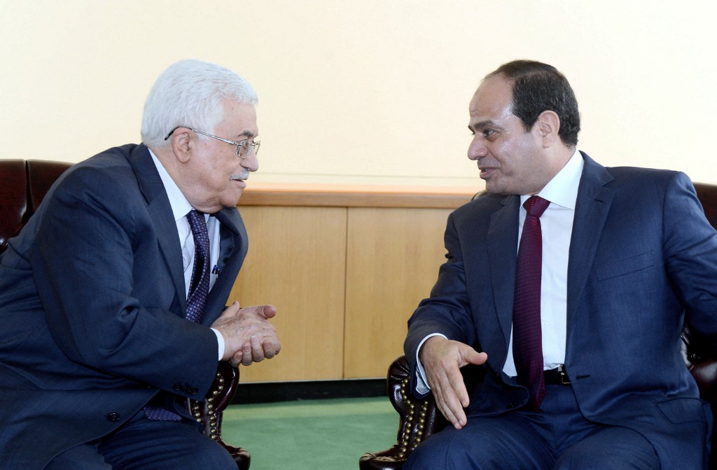 A handout picture released by the Palestinian president's office (PPO) shows Palestinian Authority President Mahmud Abbas (L) meeting with Egyptian President Abdel Fattah al-Sisi in New York on September 24, 2014