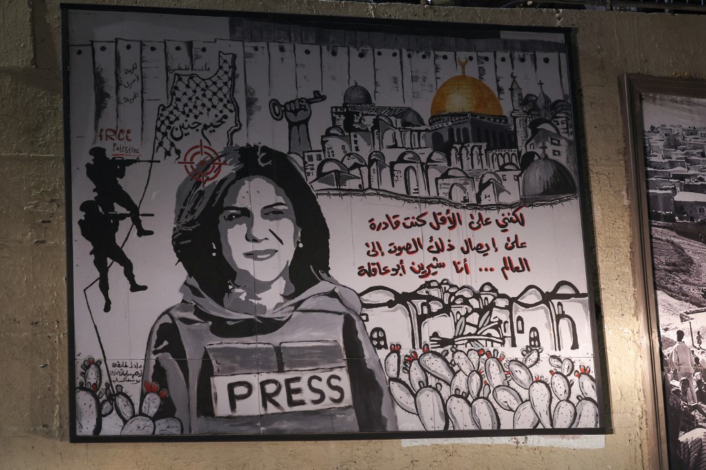 A mural depicting slain Palestinian-American journalist Shireen Abu Akleh on a street in the Arab town of Umm al-Fahm, northern Israel, on 5 September 2022 (AFP)