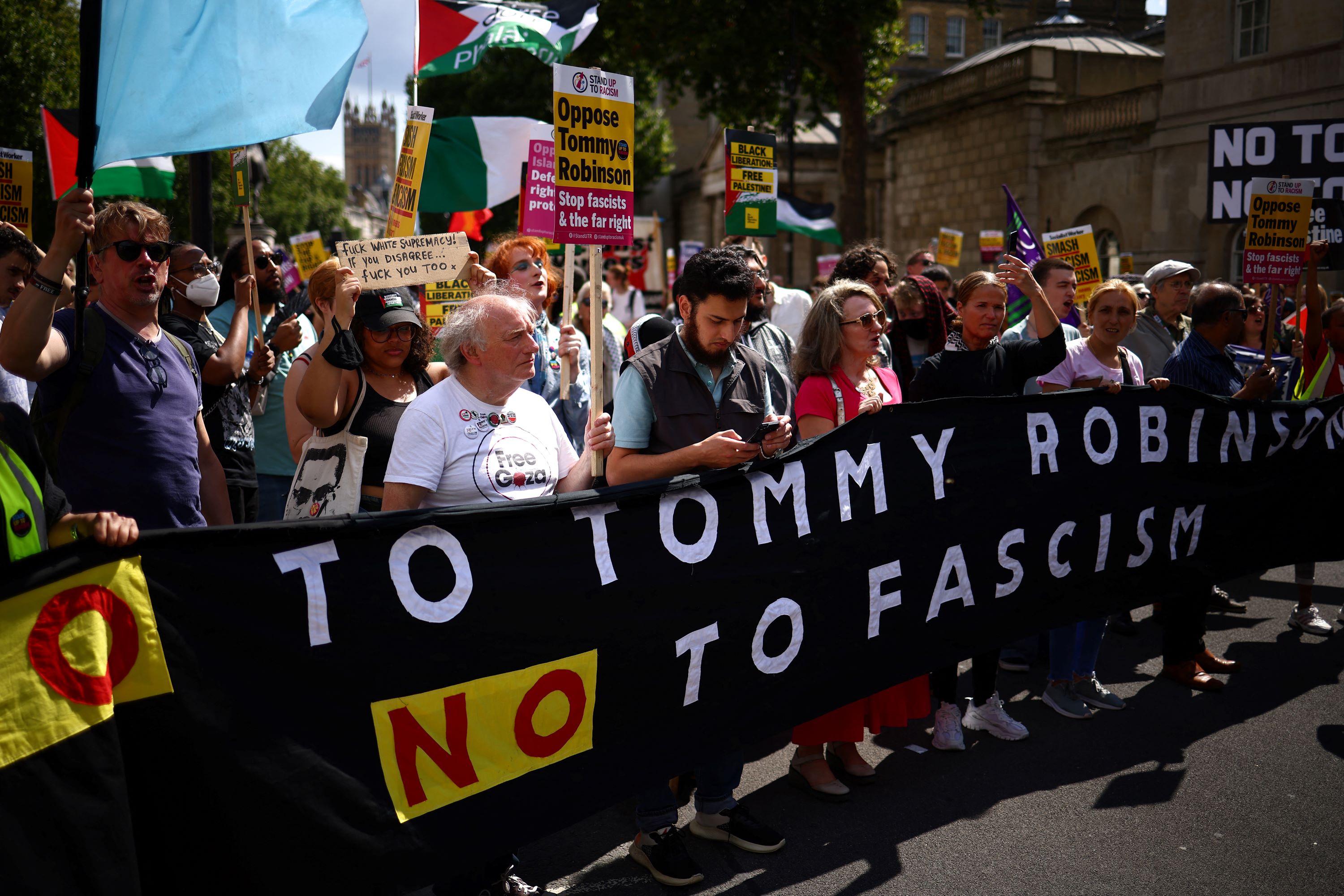 People take part in a counter-demonstration against British far-right activist Tommy Robinson (Henry Nicholls / AFP)