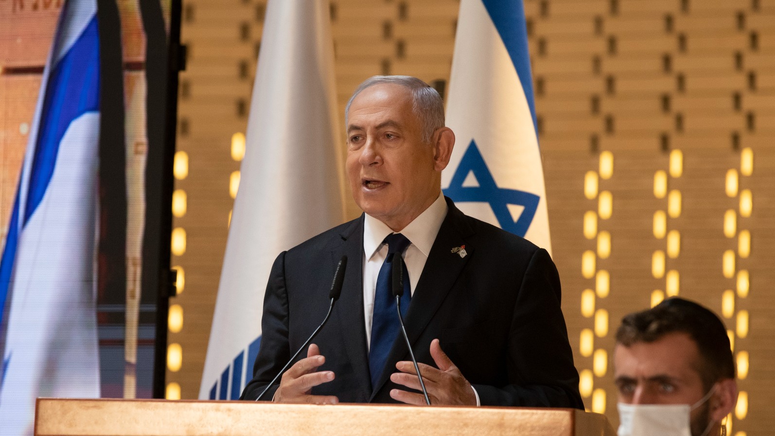 Israeli Prime Minister Benjamin Netanyahu speaks at a Memorial Day ceremony at the military cemetery at Mount Herzl, Jerusalem on 14 April 2021 (AP)