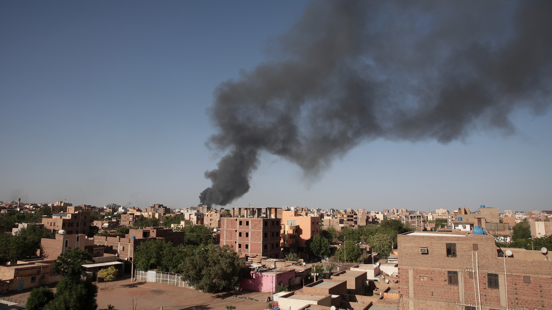 Smoke is seen in Khartoum, Sudan, 19 April (AP)