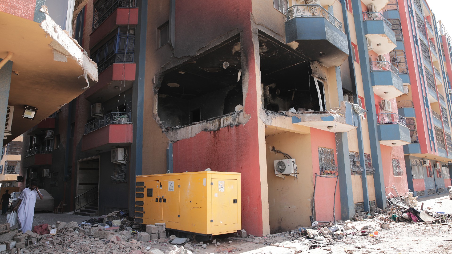 Residential buildings damaged in fighting are seen in Khartoum, Sudan, 20 April (AP)