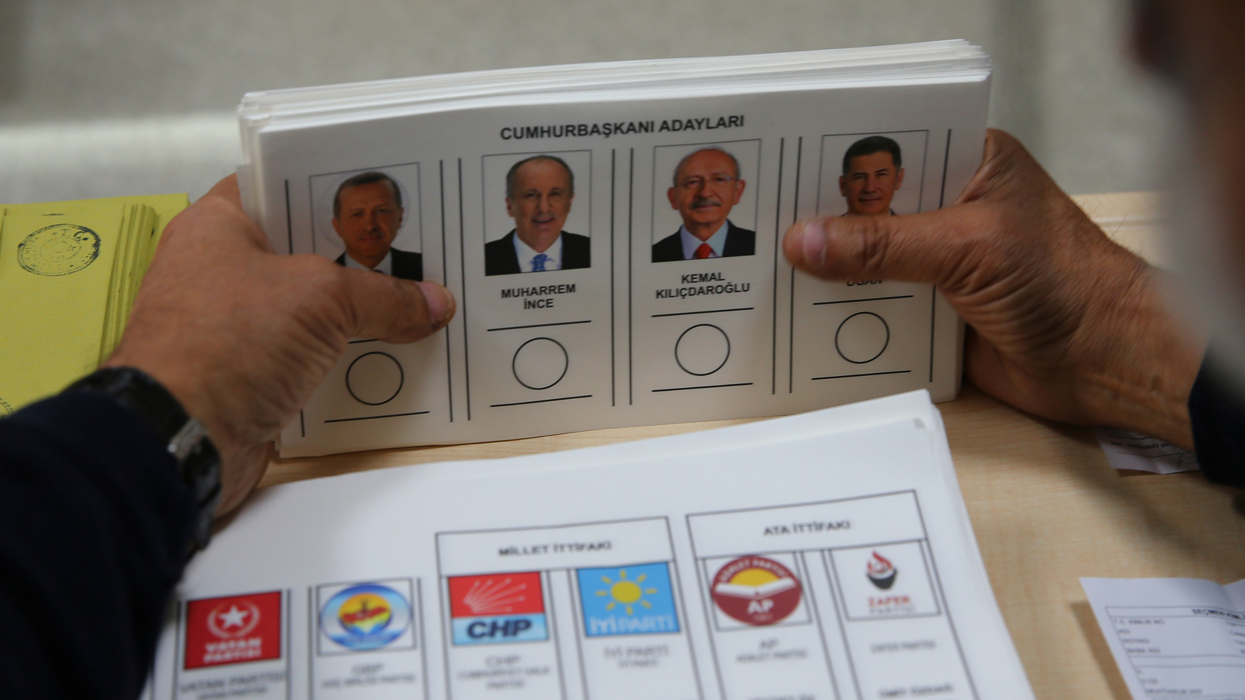 An official prepares ballots with presidential candidates at a polling station in Ankara, Turkey 14 May 2023 (AP)