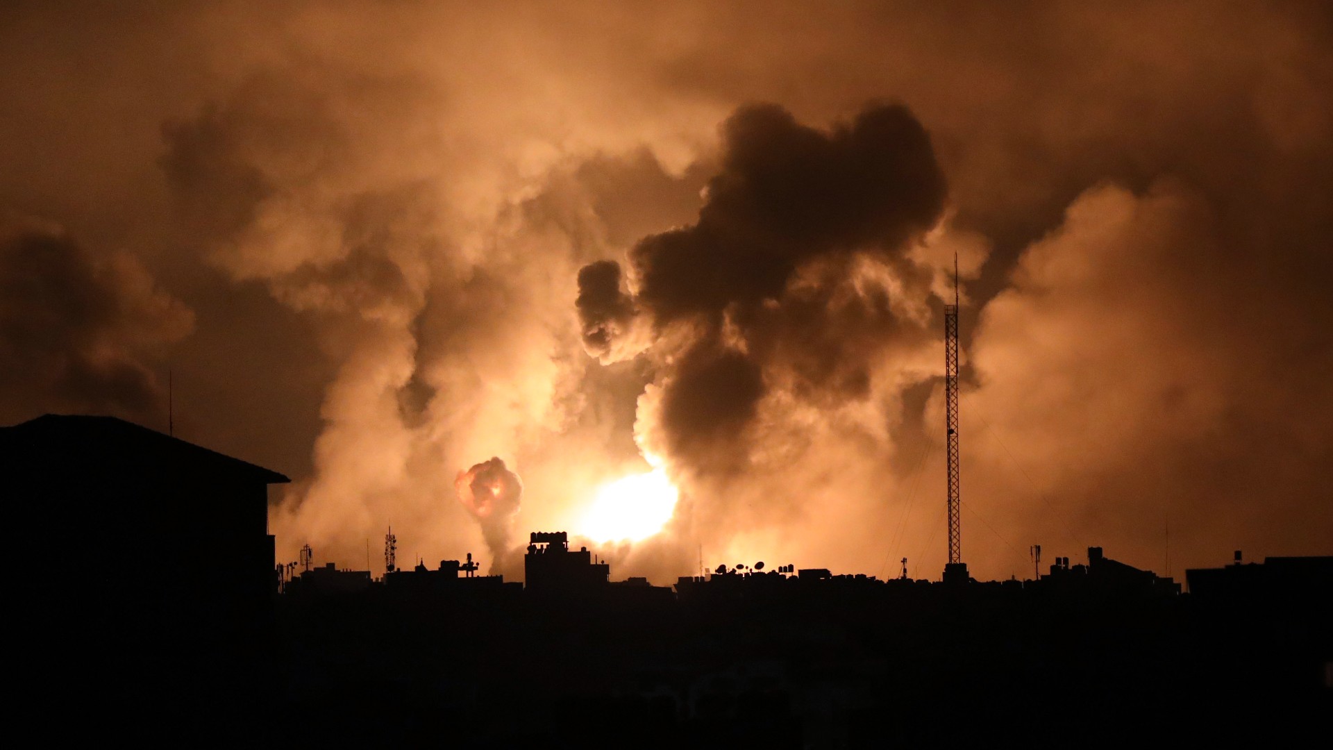 Explosions caused by Israeli air strikes in the northern Gaza Strip, 27 October (AP)