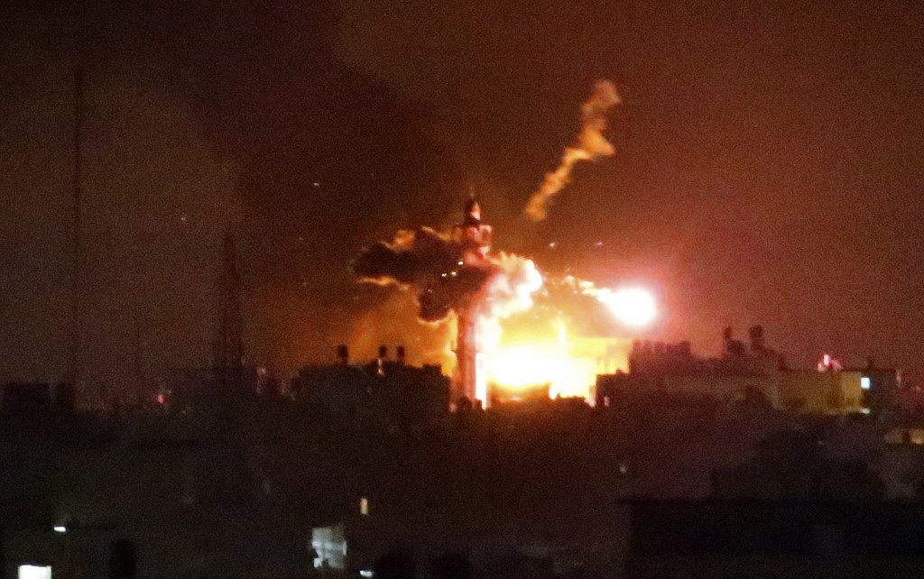 An Israeli mortar hits a mosque during Israeli air strikes on Gaza City, 19 July 2014